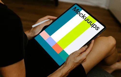 Tablet mockup held with an Apple Pencil
