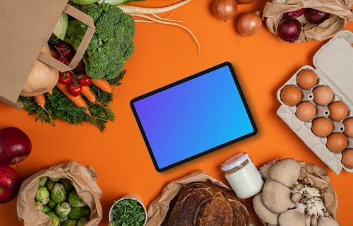 Tablet mockup surrounded by fresh groceries