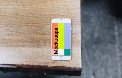 Top view mockup of iPhone 7 Silver mockup on the wooden table