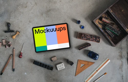 Top view of landscape tablet mockup with stamps and rulers