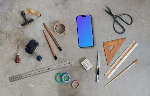 Top view of phone mockup with a ruler and scissors