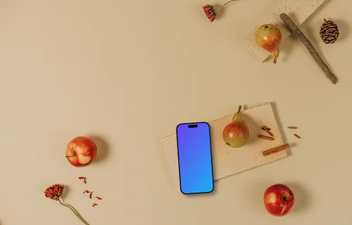 Top view of phone mockup with apples around