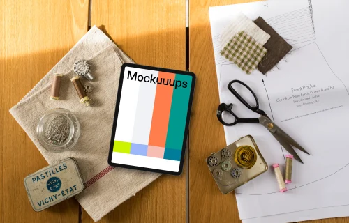 Top view of tablet mockup with sewing table on the side