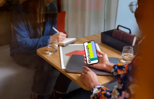 Woman holding an iPhone 14 Pro mockup