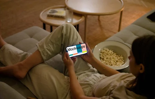 Woman holding an iPhone mockup