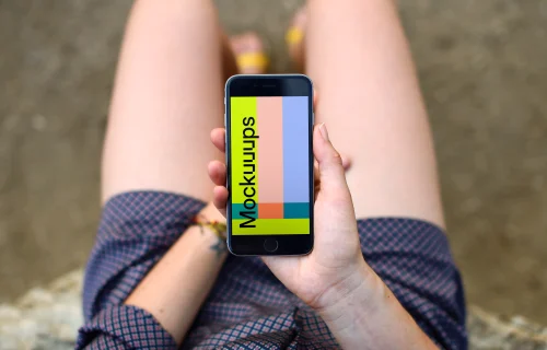 Woman in shorts looking on iPhone 6s mockup