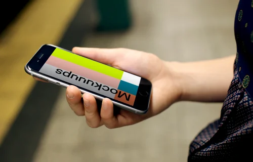 Woman with iPhone 6s mockup in Underground Station
