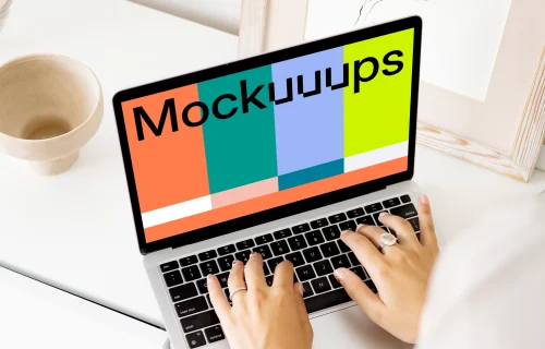 Young lady typing on a MacBook Pro mockup