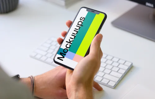 Young man holding iPhone 11 mockup