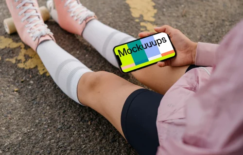 Young woman holding a smartphone mockup