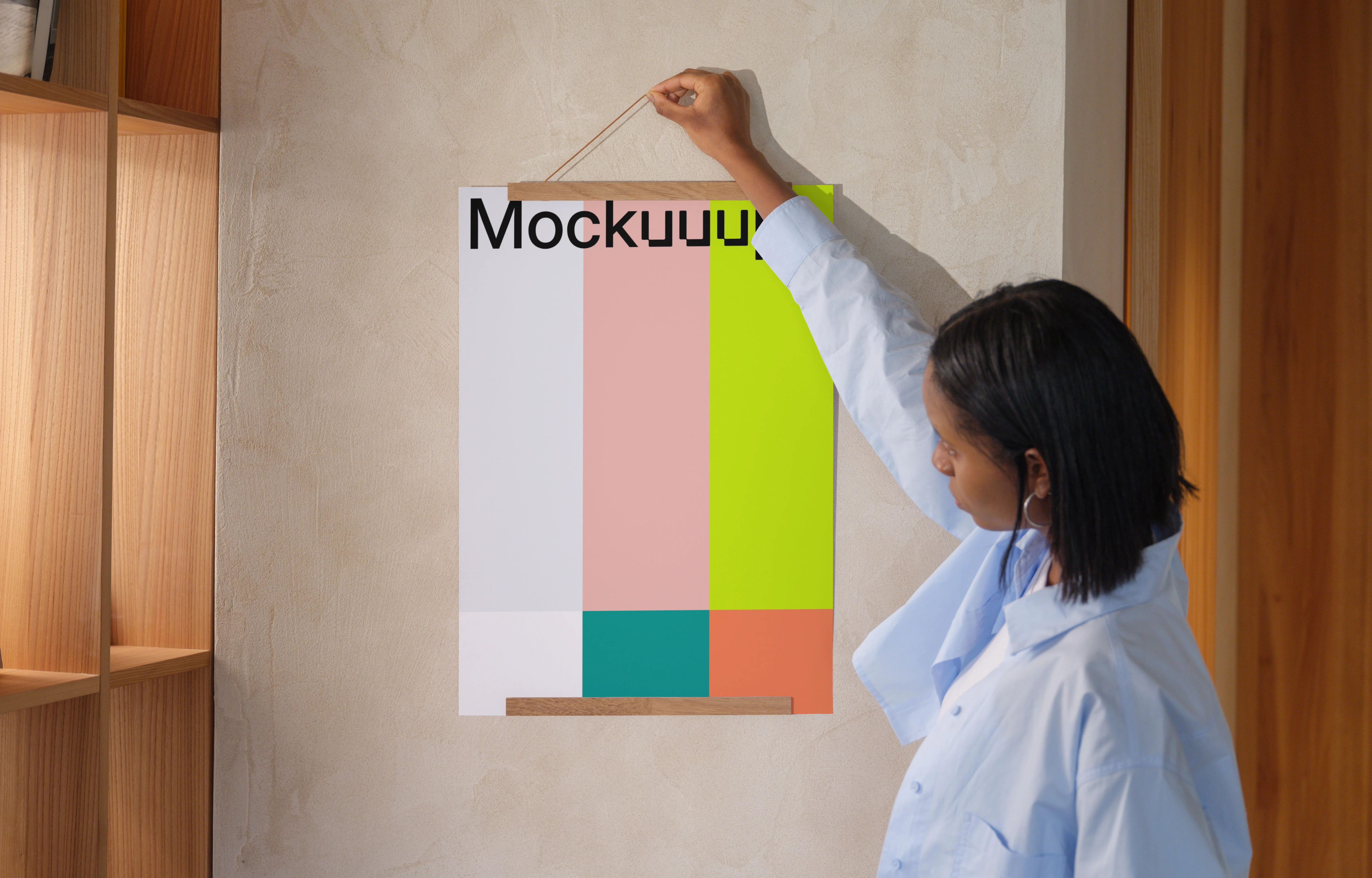 A3 poster mockup held against a textured wall