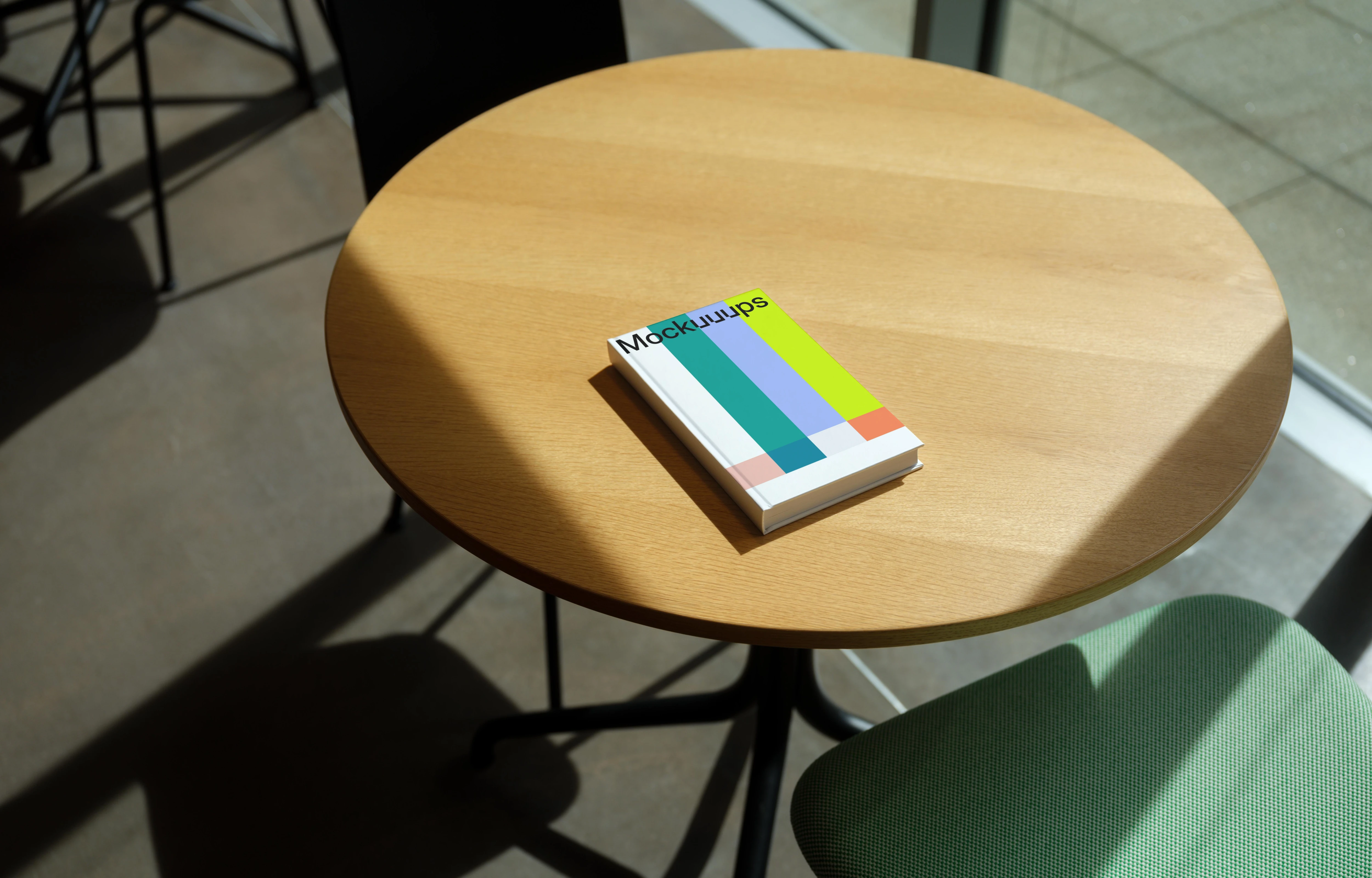 C-format book mockup on a wooden round table