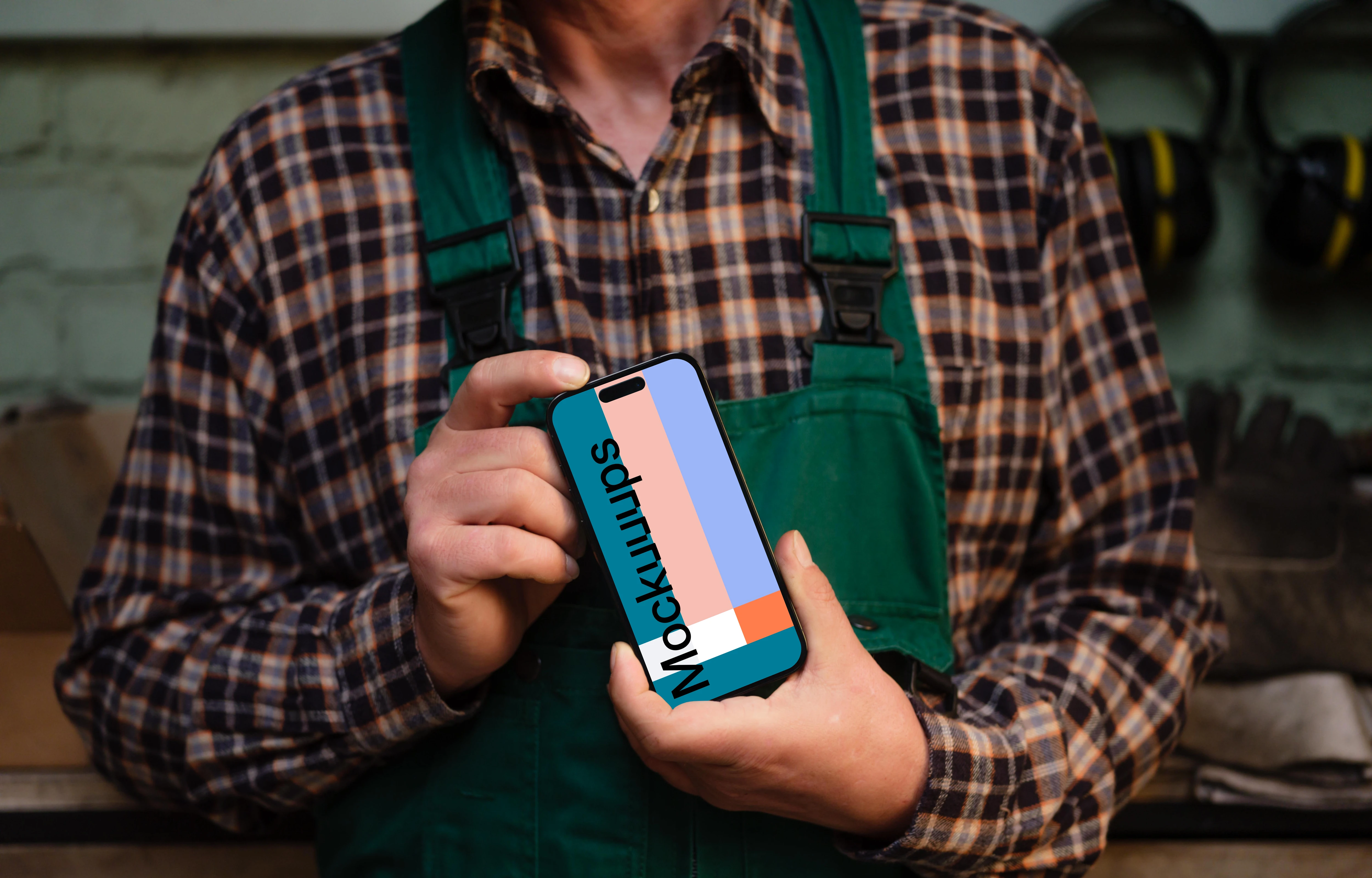 Crafter holding an iPhone 14 Pro mockup