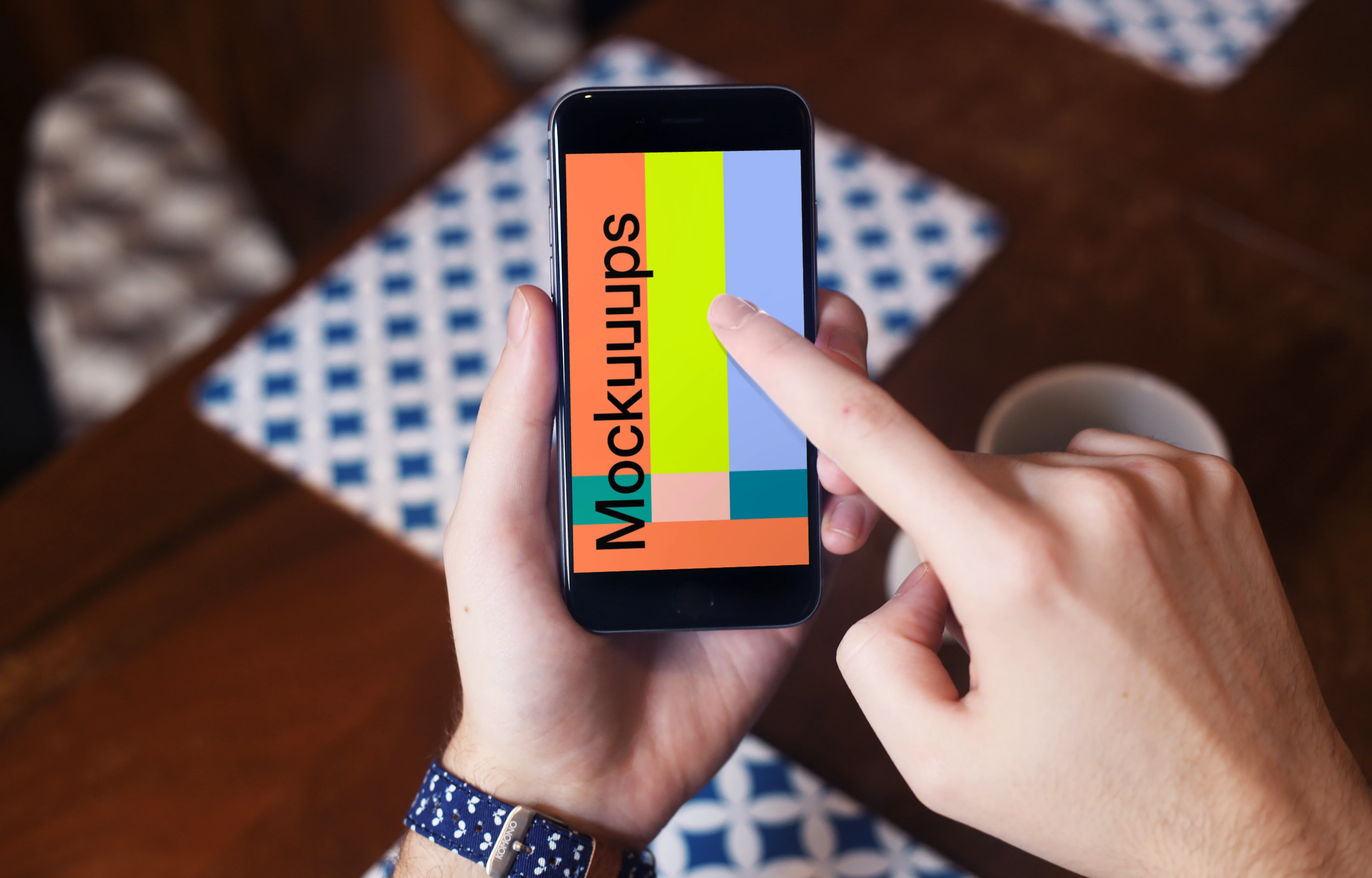 Drinking coffee and pointing on iPhone 6 mockup