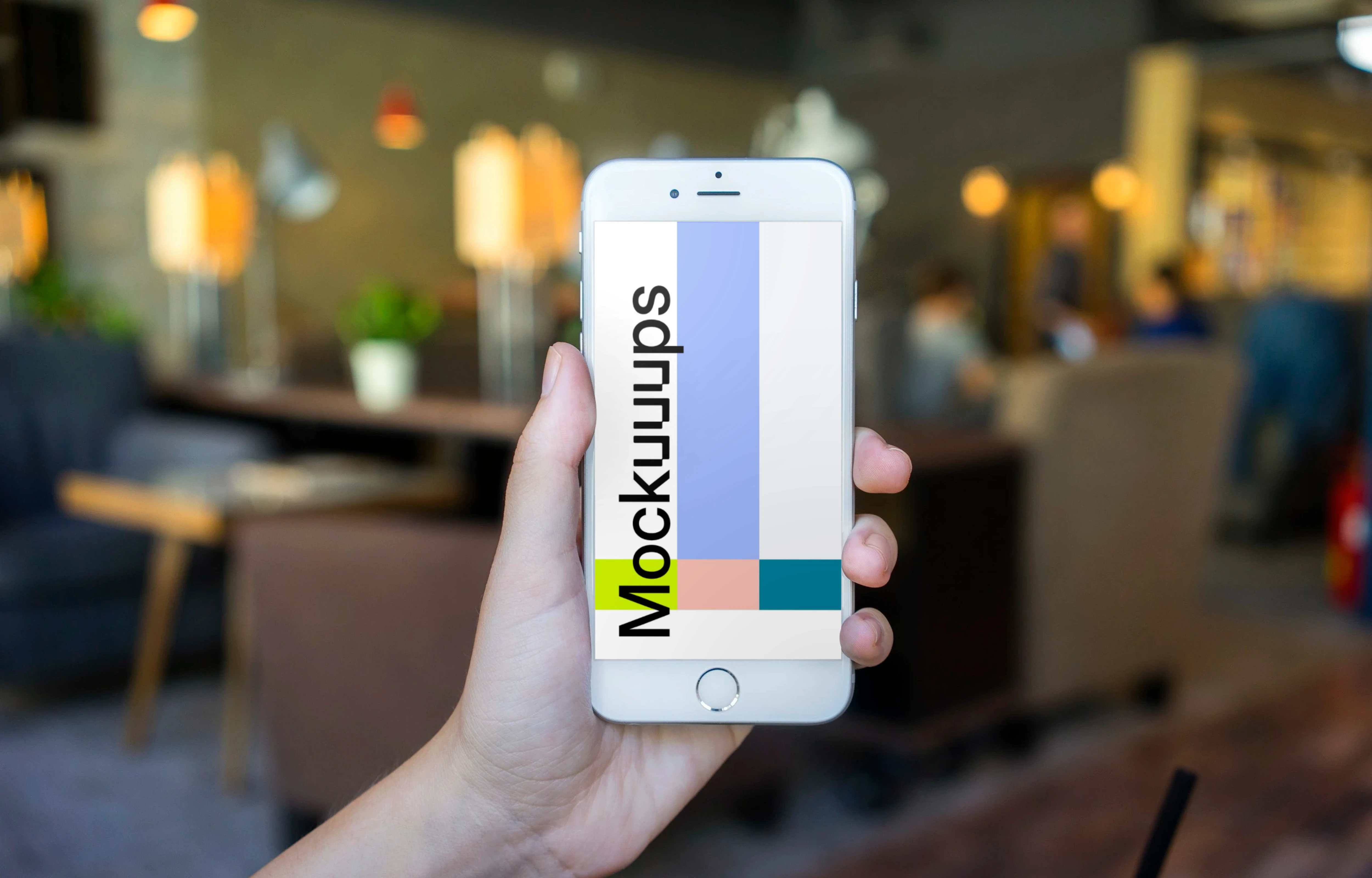 Holding iPhone 6 mockup in shop