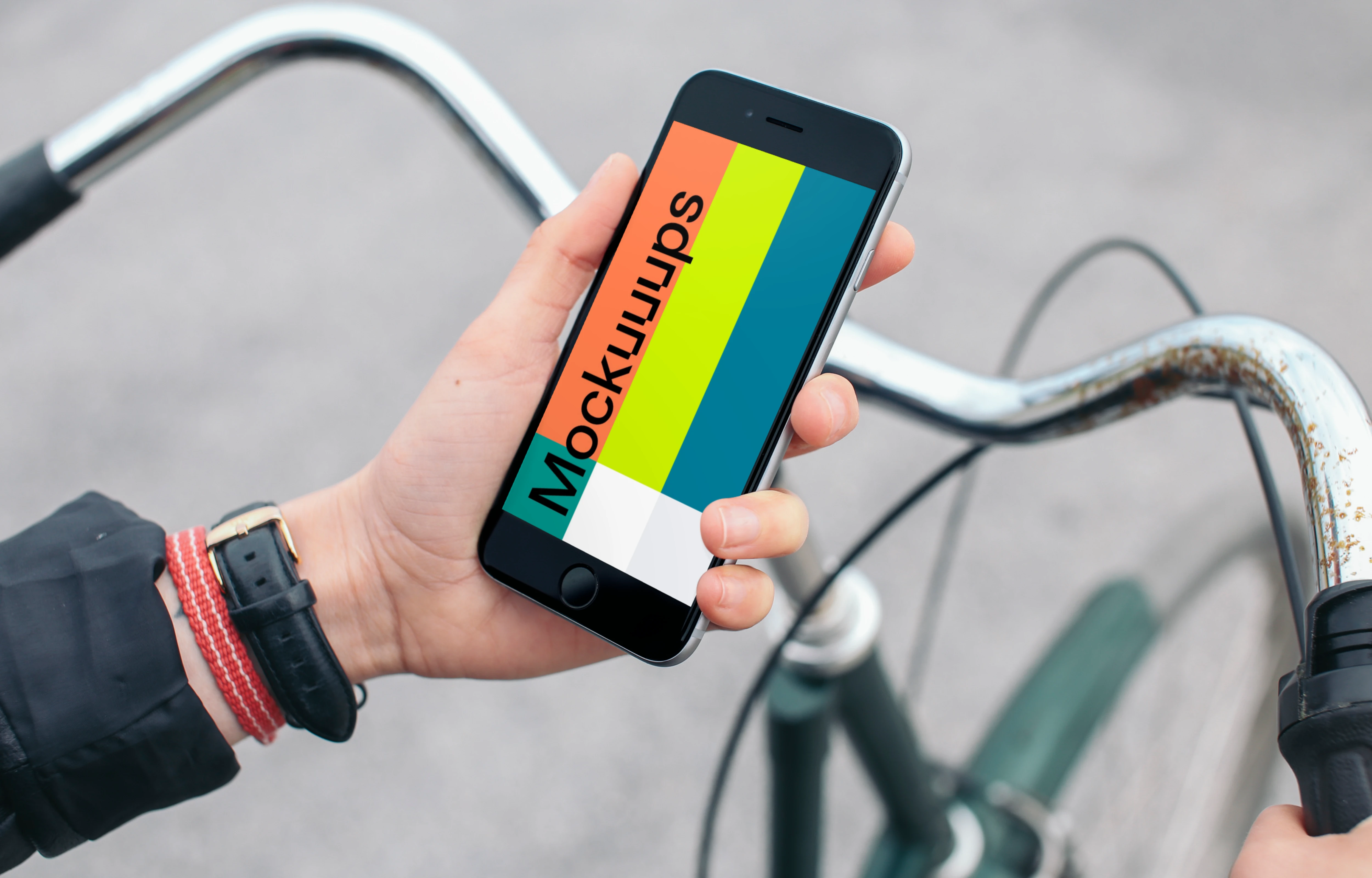Holding iPhone 6s Space Gray mockup on bike
