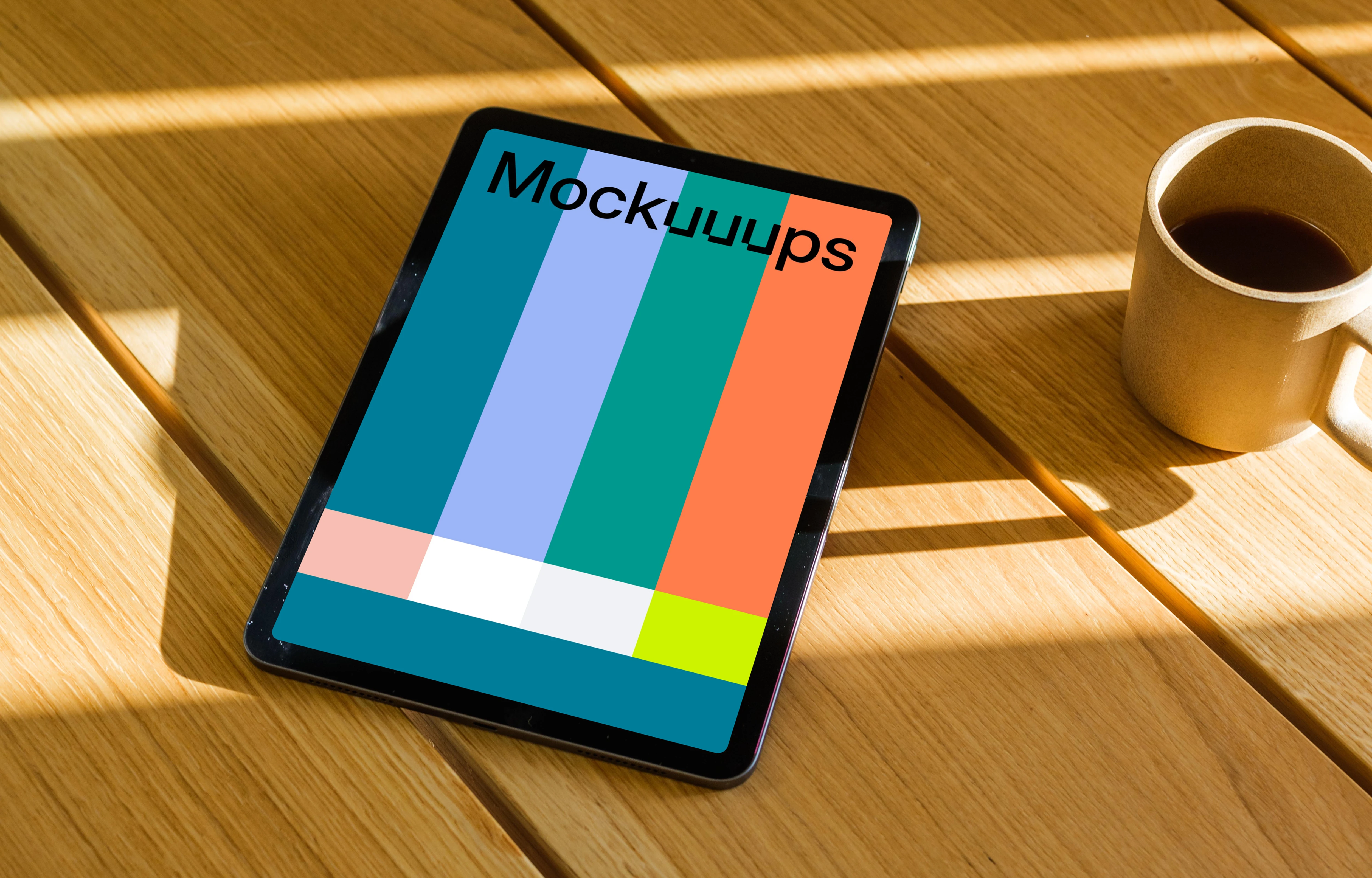 iPad Air mockup on a wooden table beside a mug of coffee