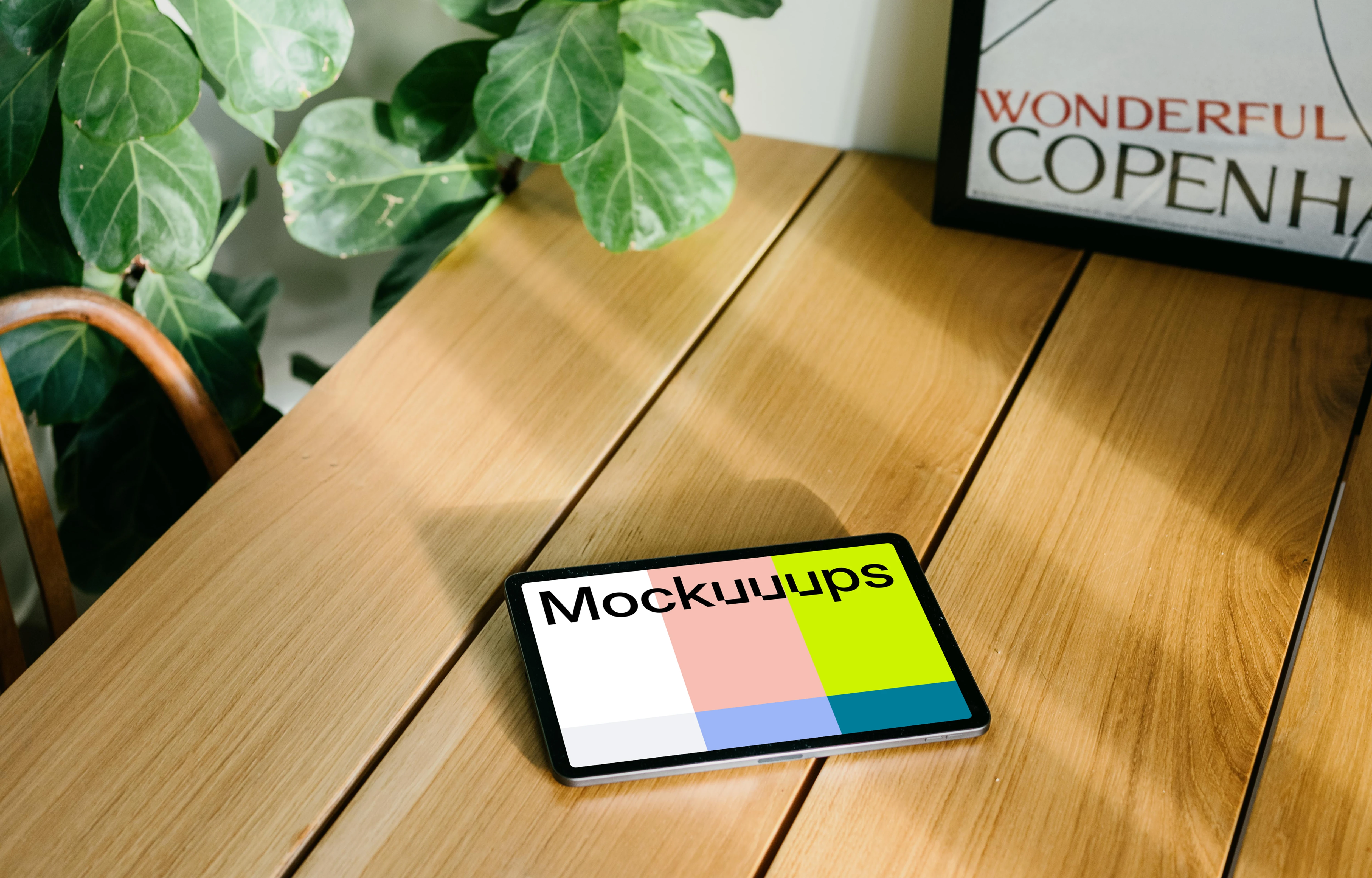 iPad Air mockup with a framed photo in the background