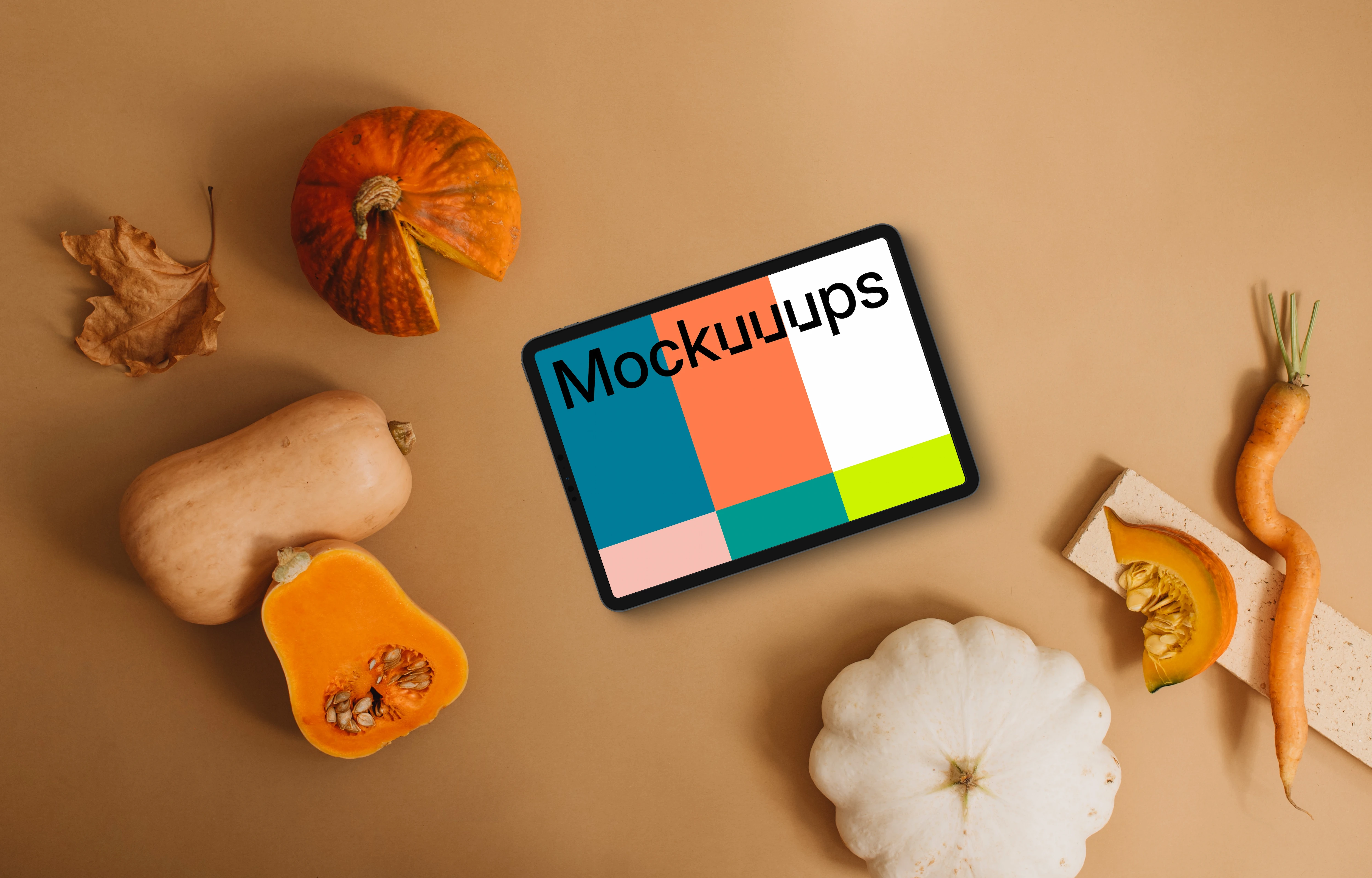 Landscape tablet mockup next to the pumpkin