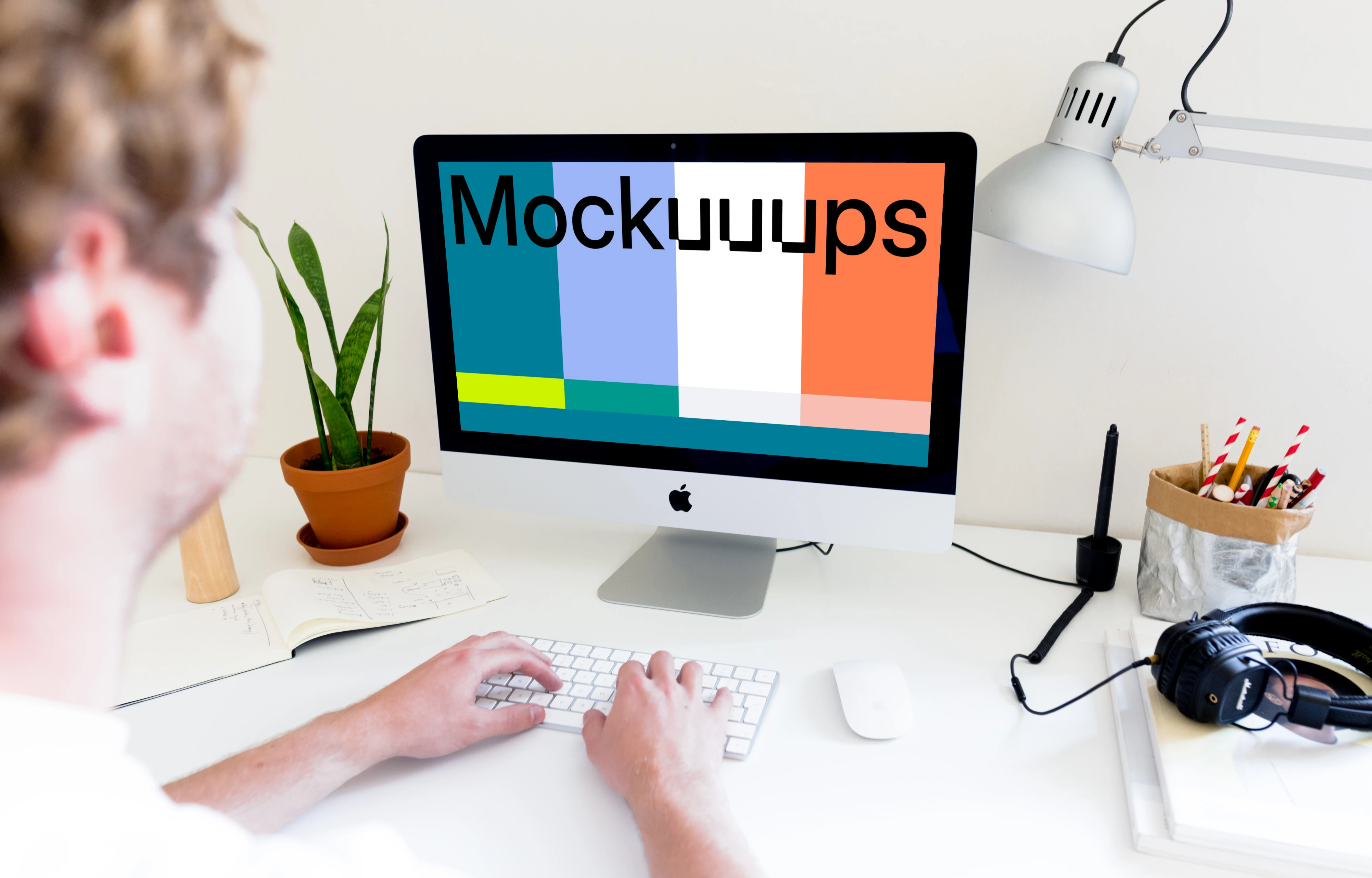 Man working on iMac mockup