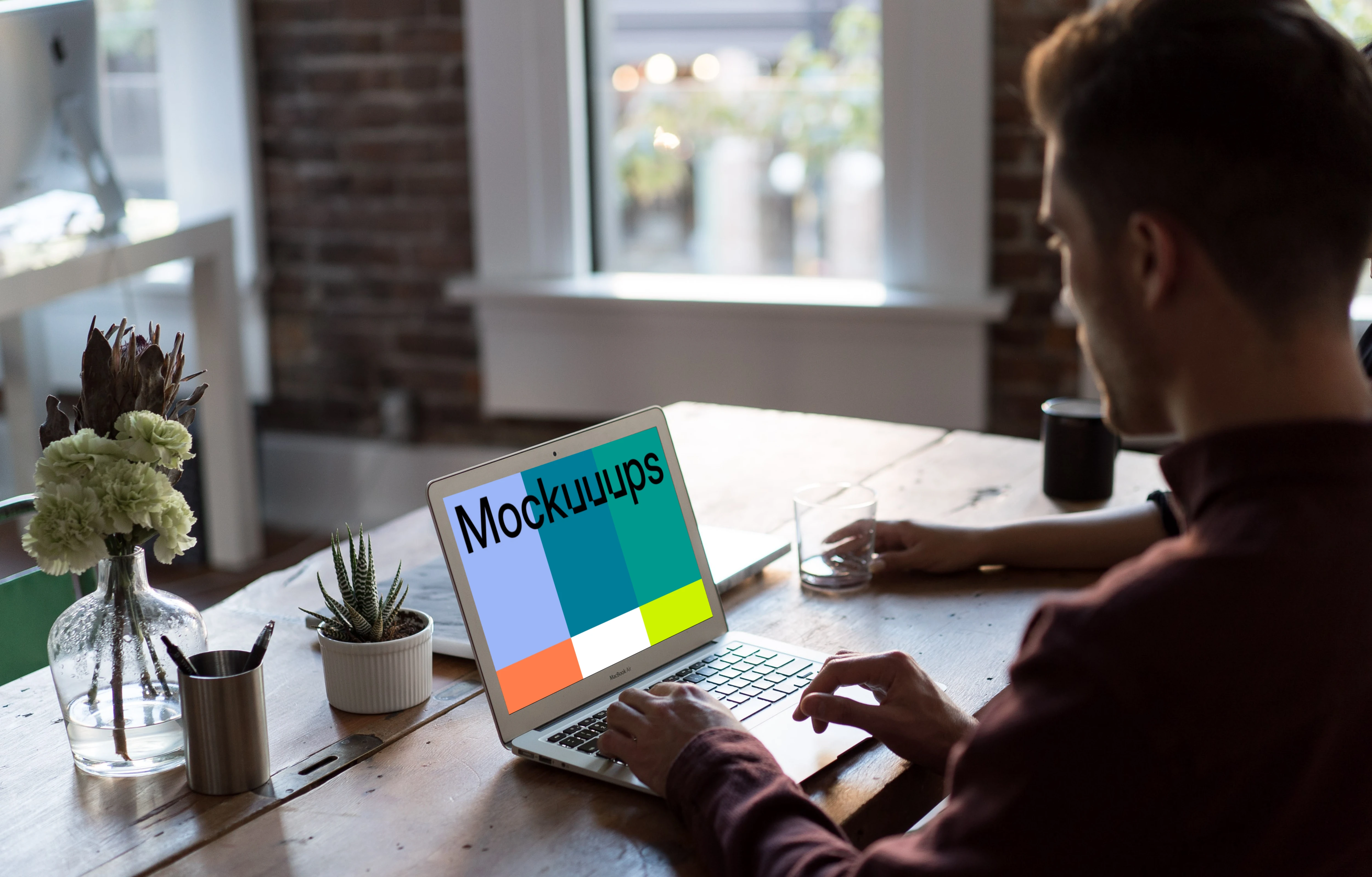 Man working on Macbook Air mockup