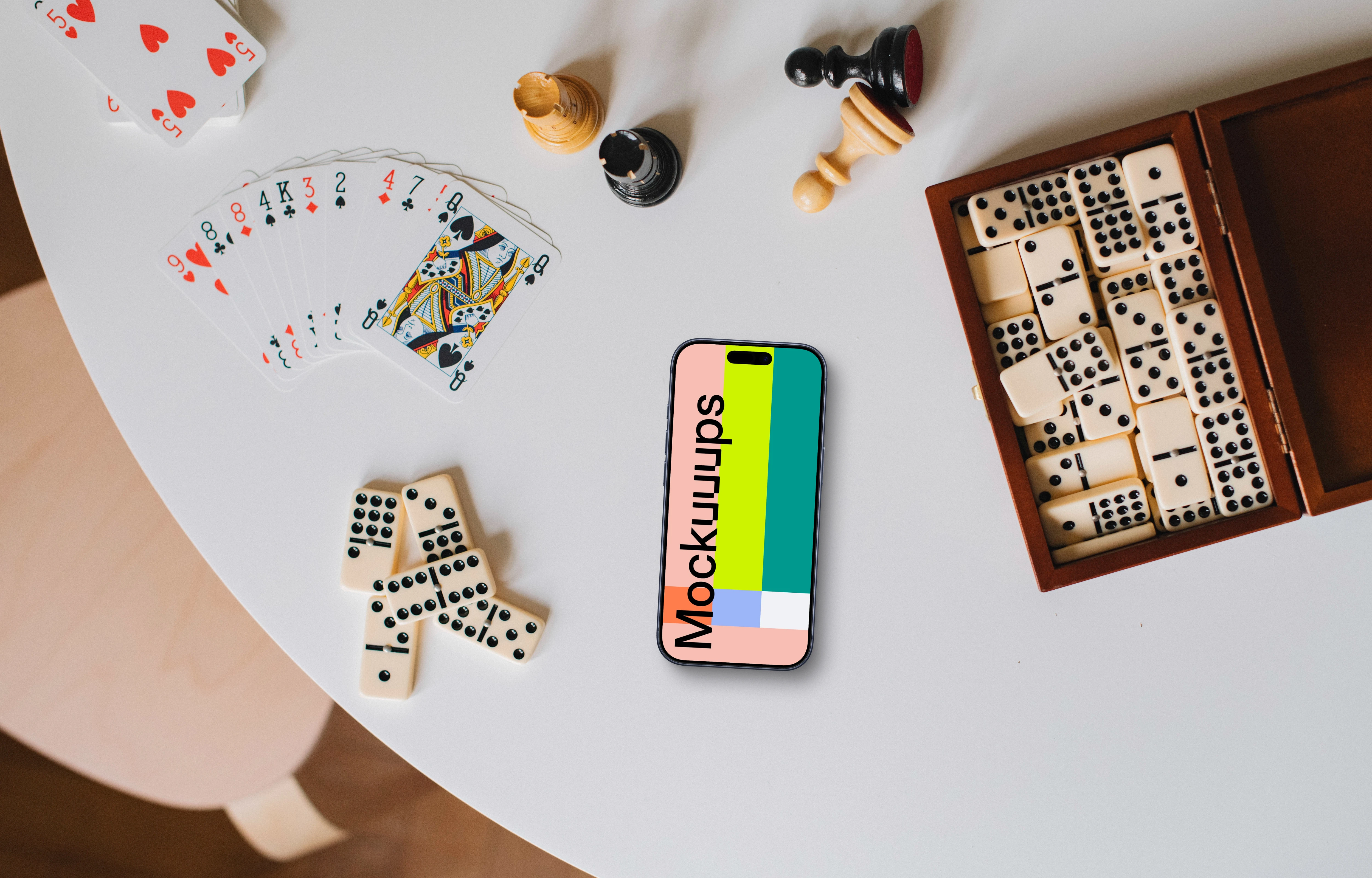 Playful environment including board games and iPhone mockup