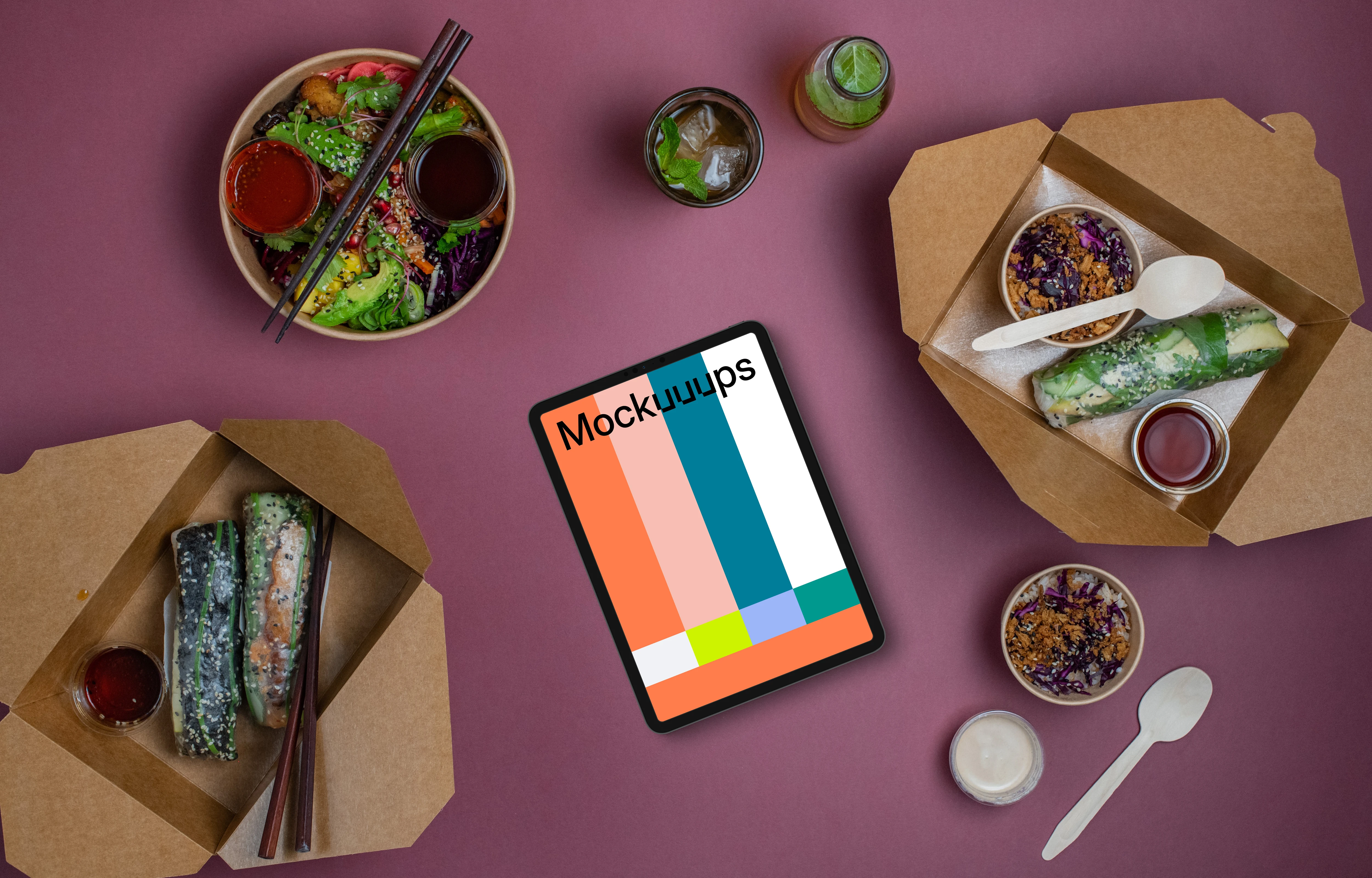 Tablet mockup surrounded by Asian food from delivery