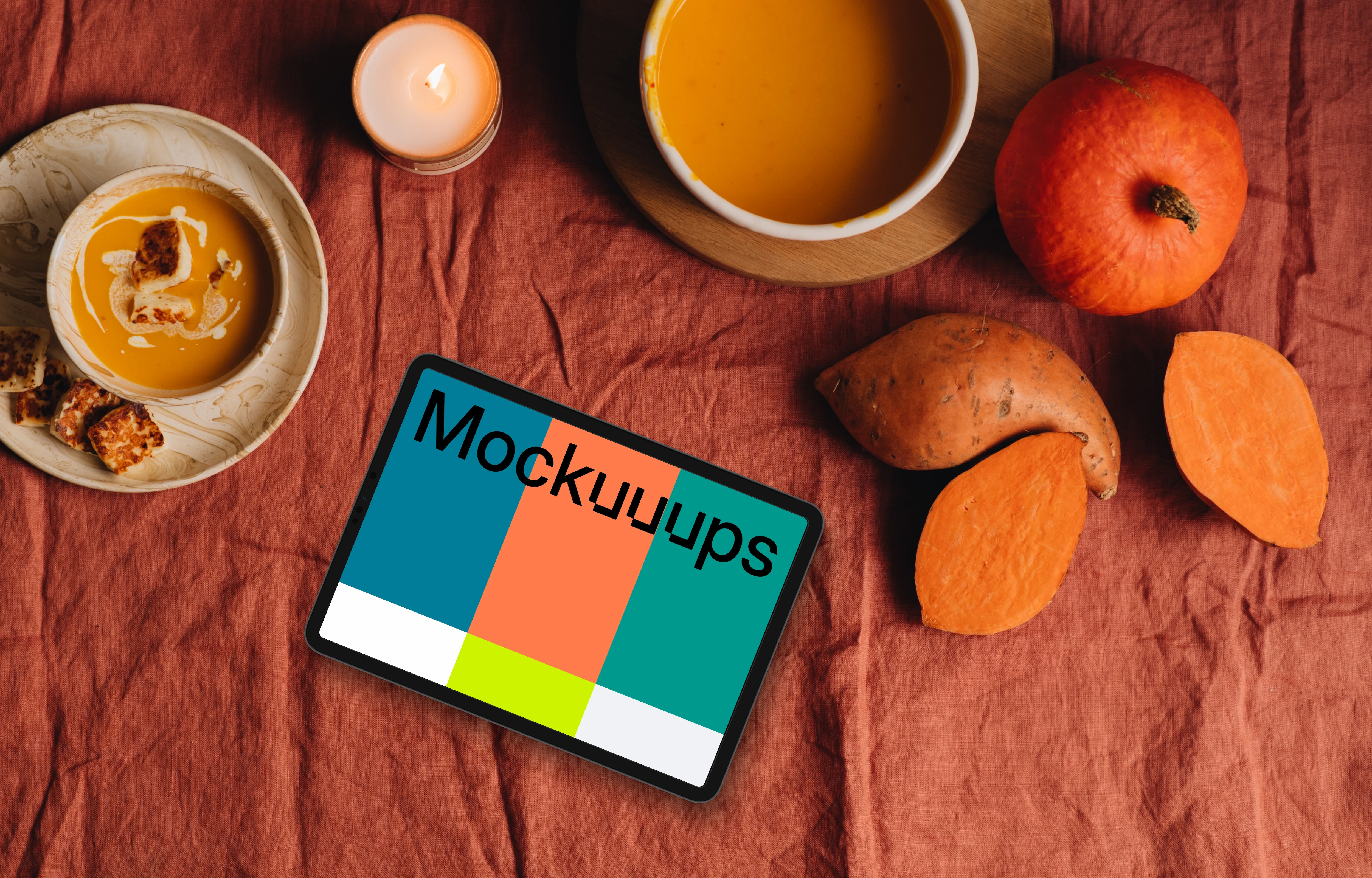 Top view of landscape tablet mockup next to pumpkins