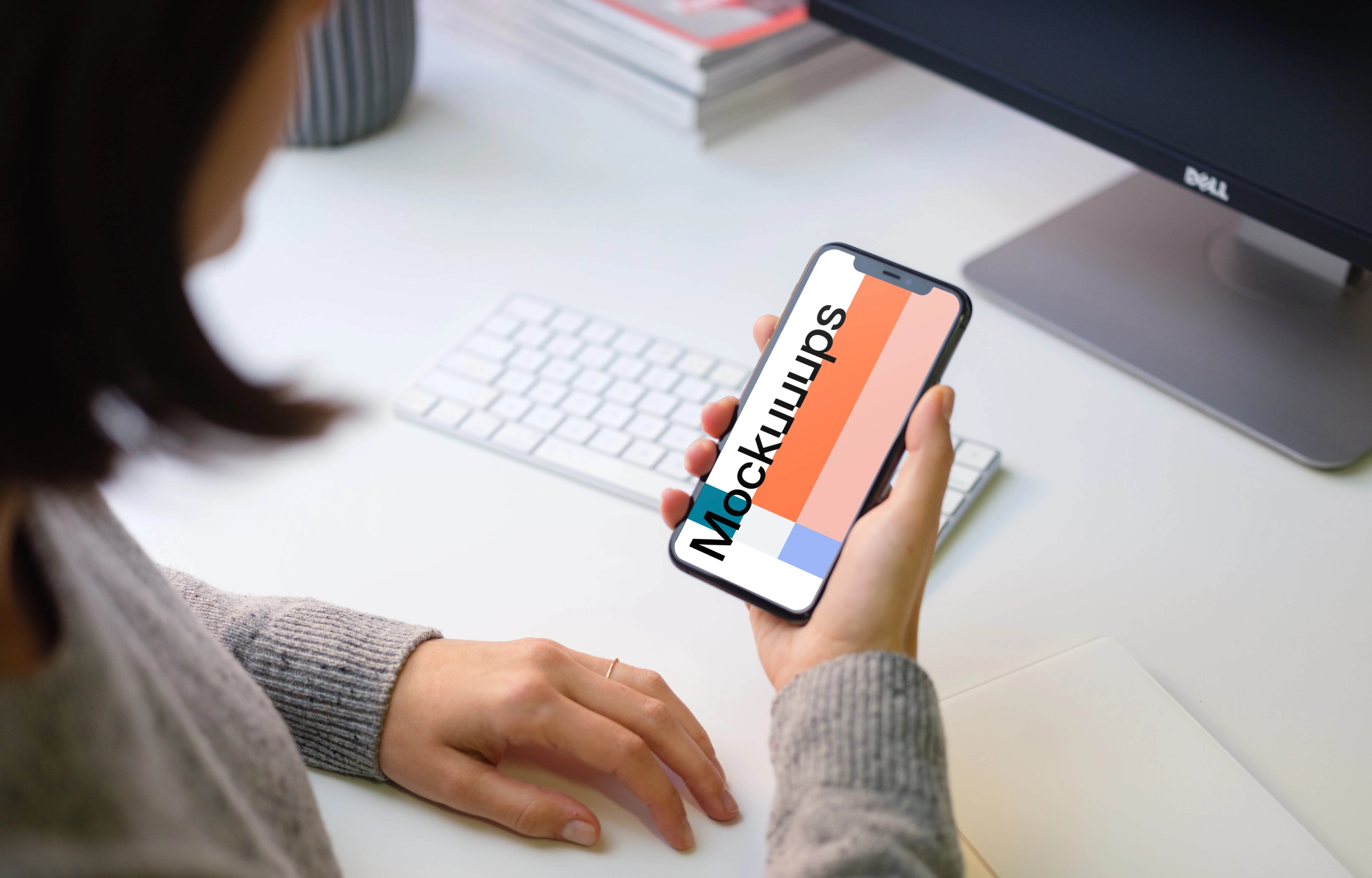 Young woman holding iPhone 11 mockup