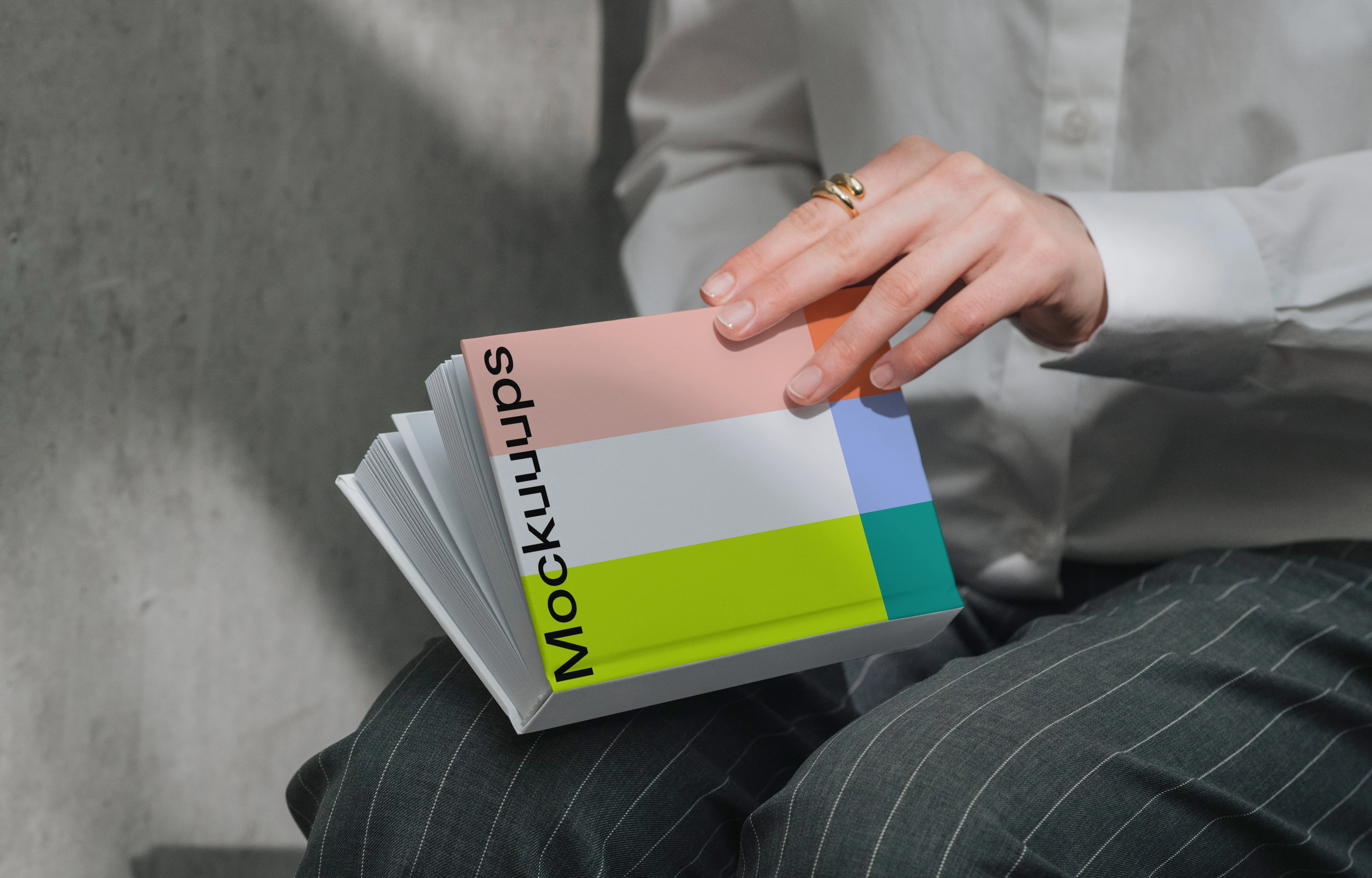 A-format book mockup held in hands