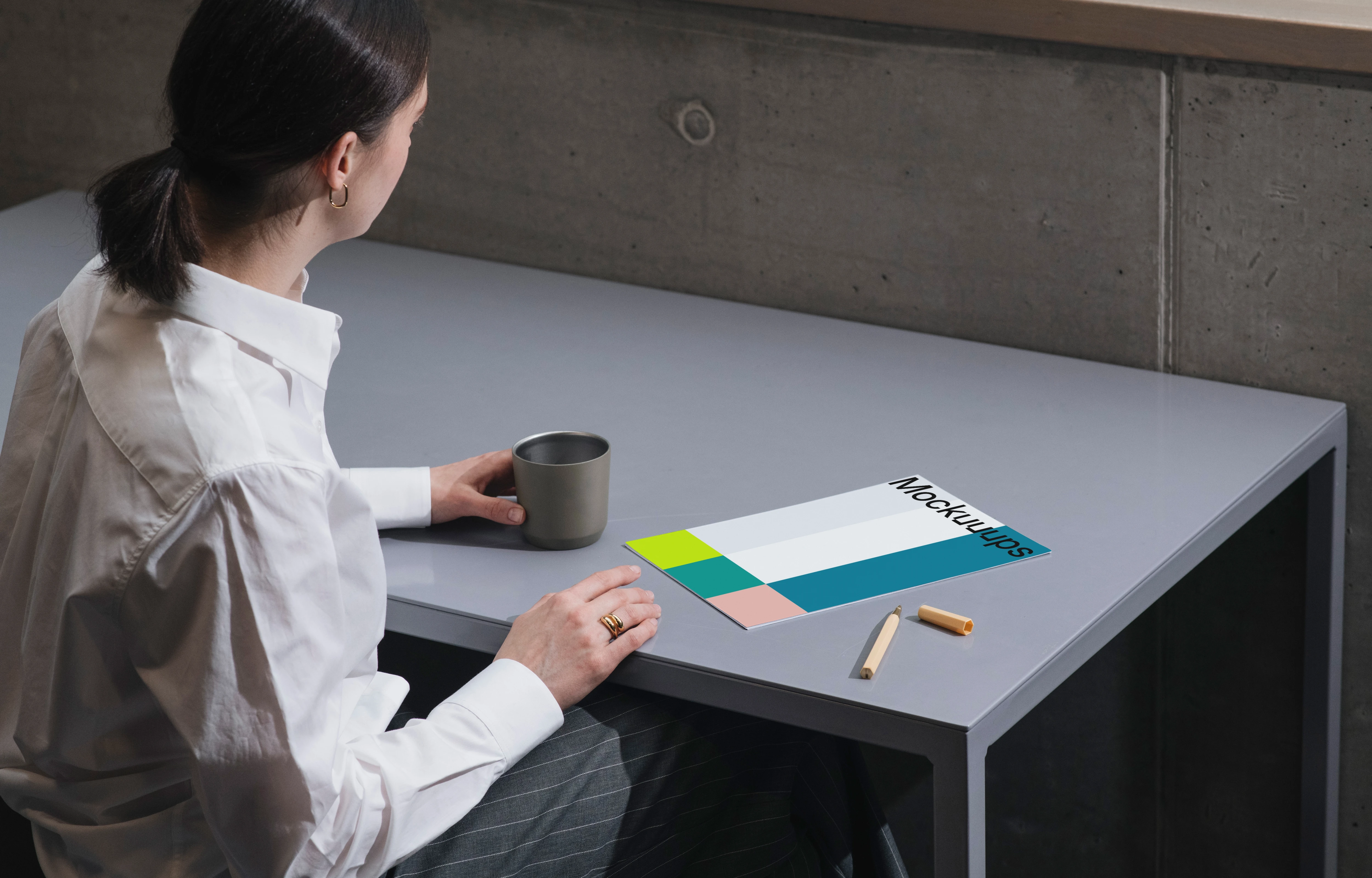 A4 mockup on a gray desk with office elements