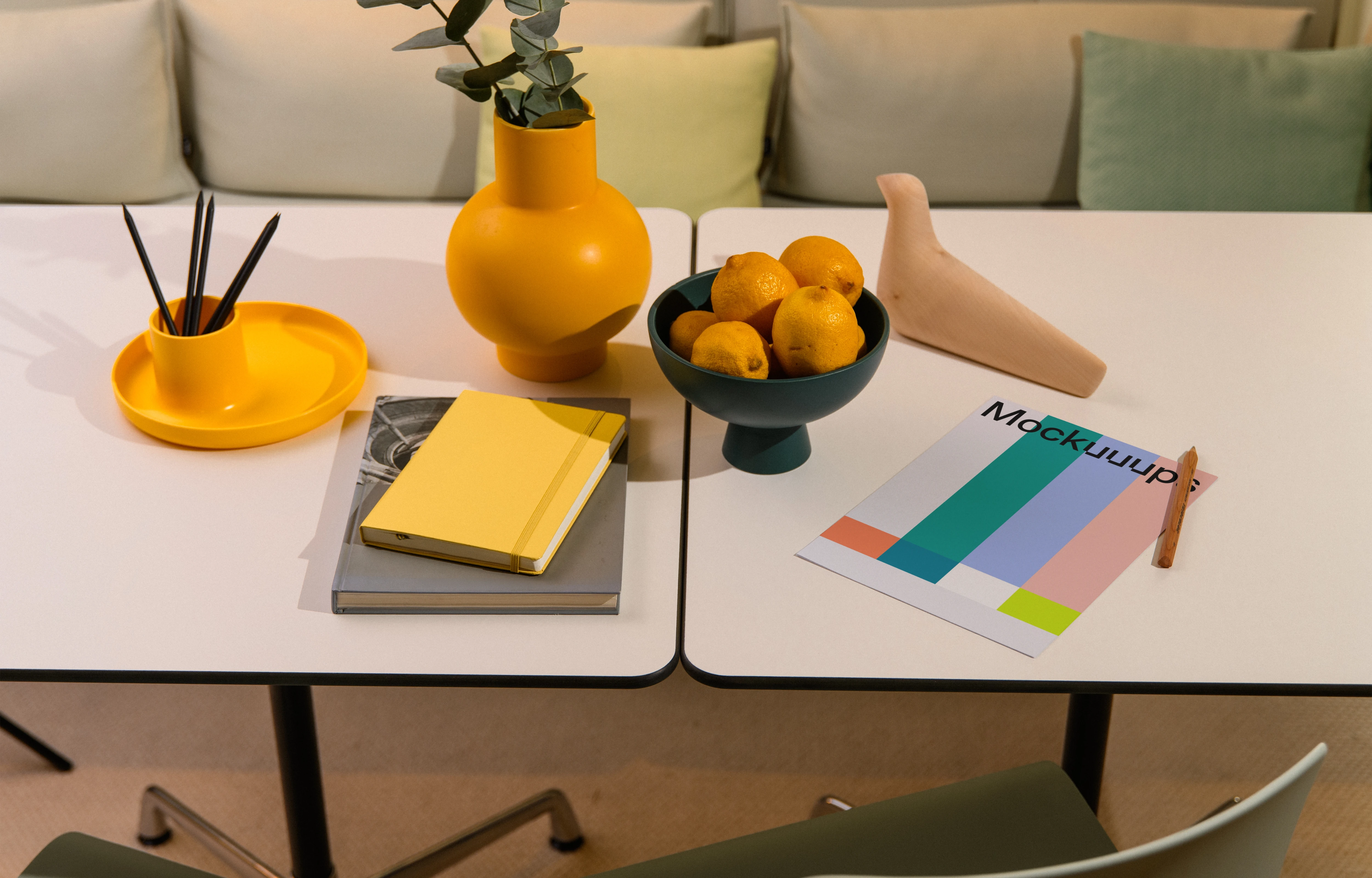 A4 mockup on a modern table with colorful decorations