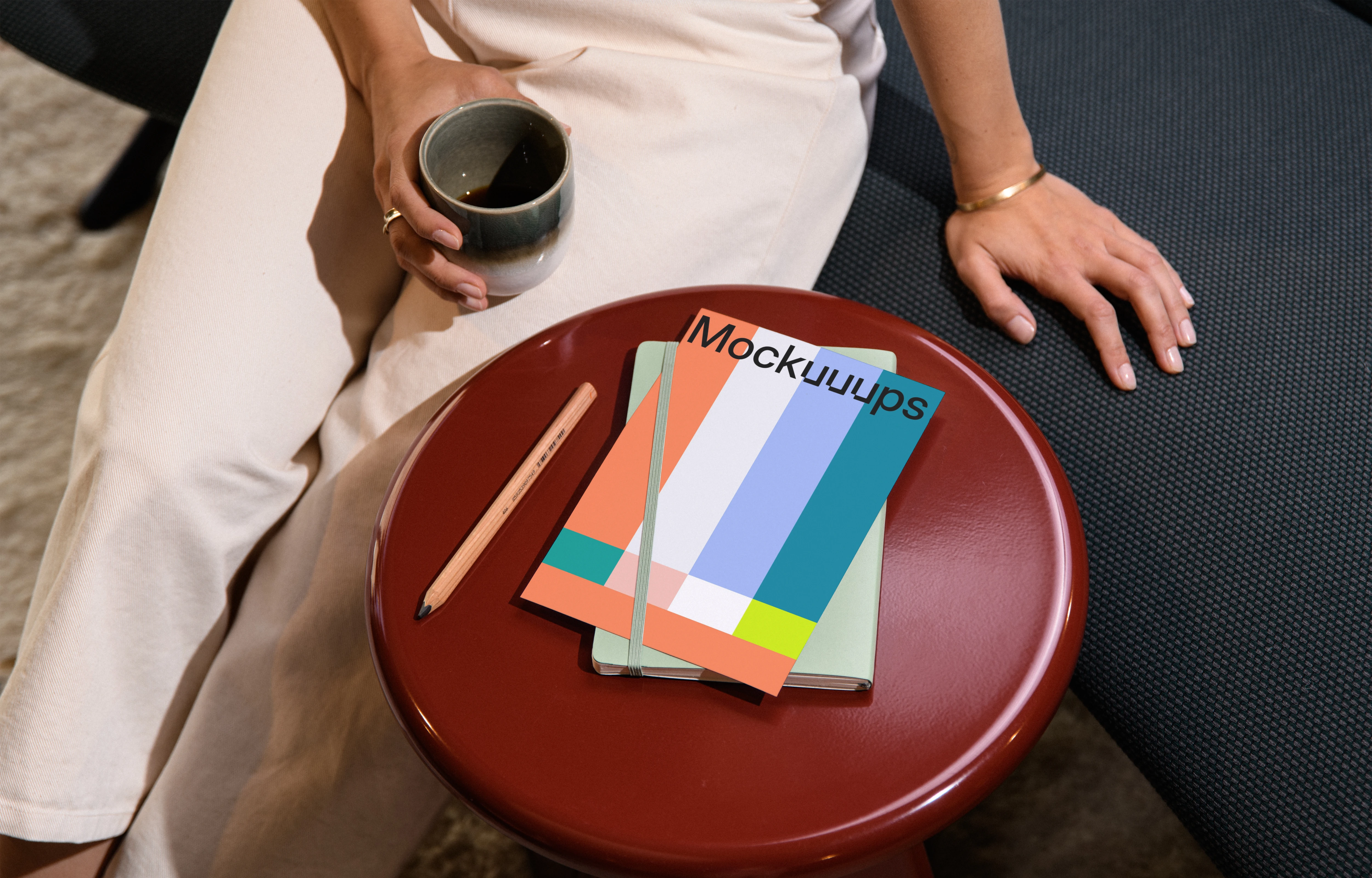 A4 paper mockup on a red round side table