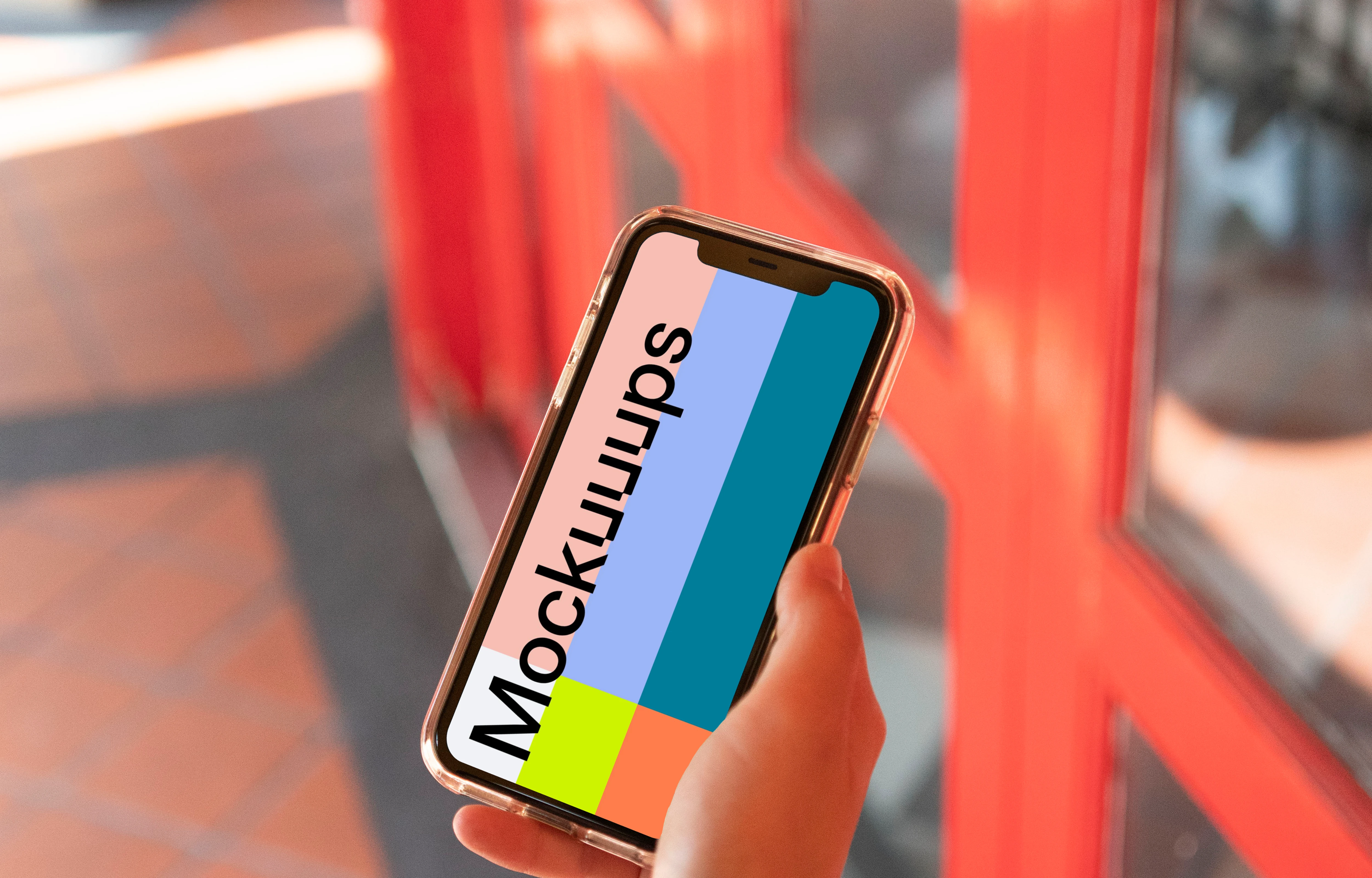 iPhone mockup help by user beside red doors