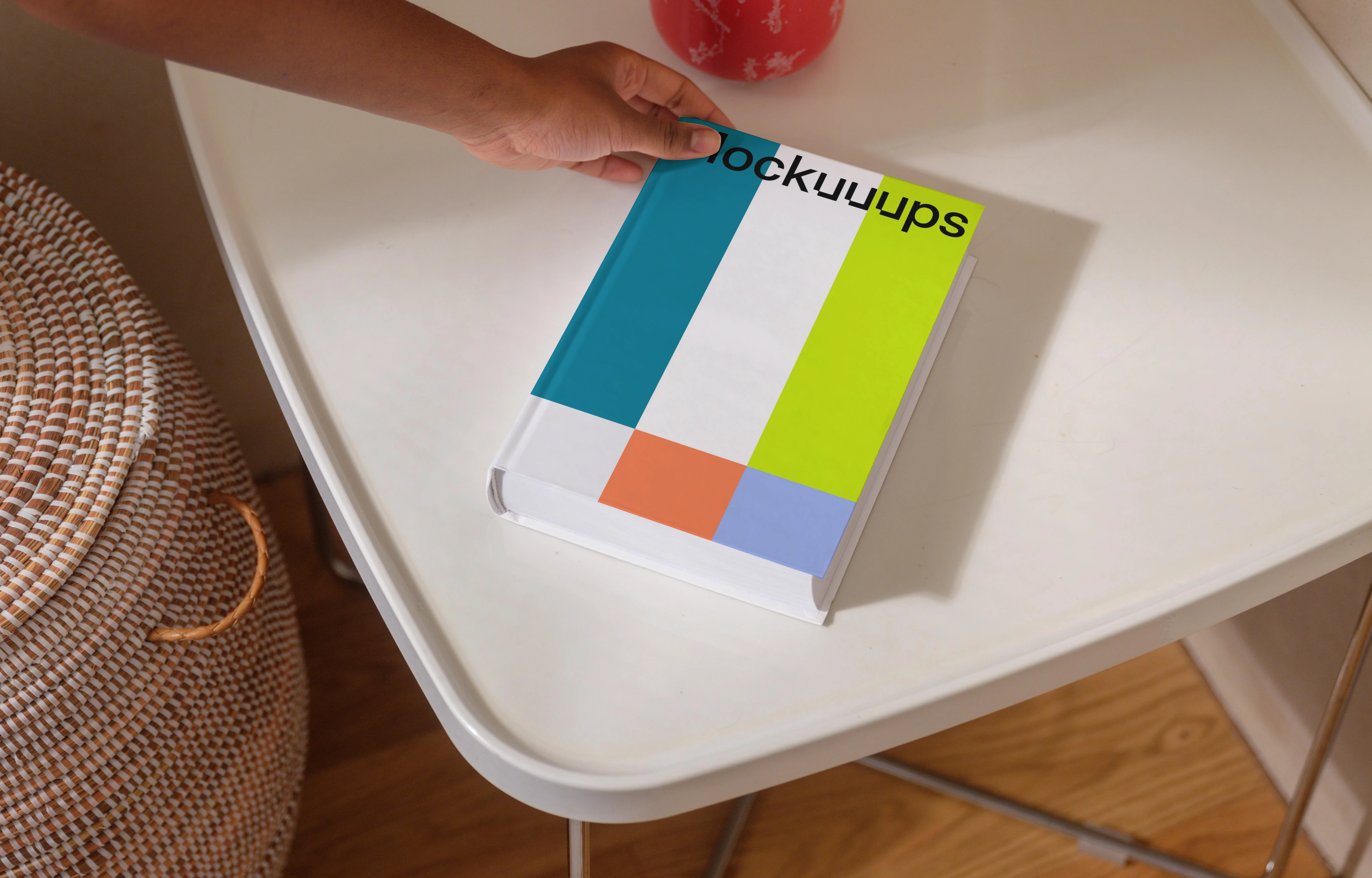 B-format book mockup on a modern white table