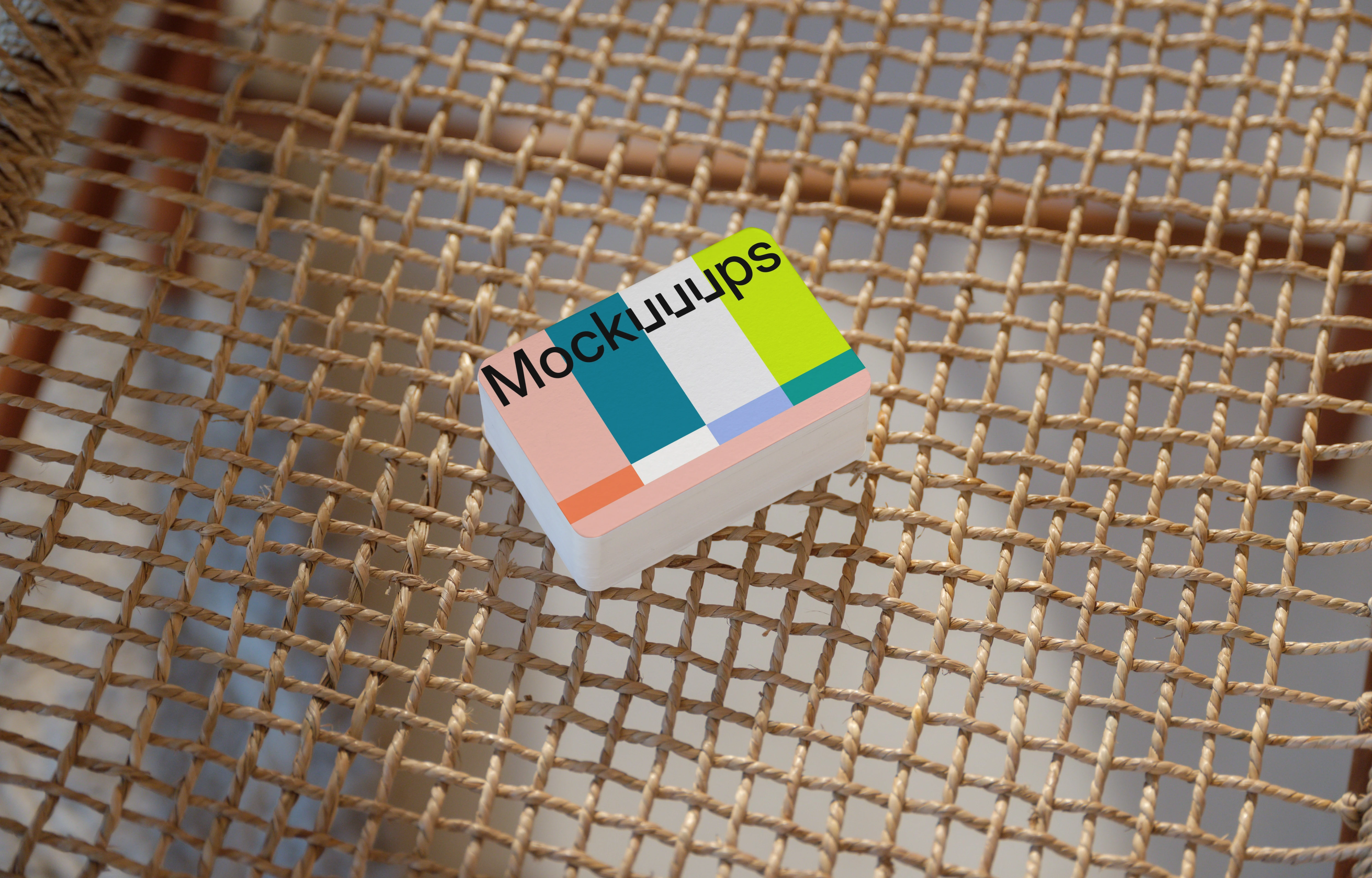Business card mockup on a woven chair