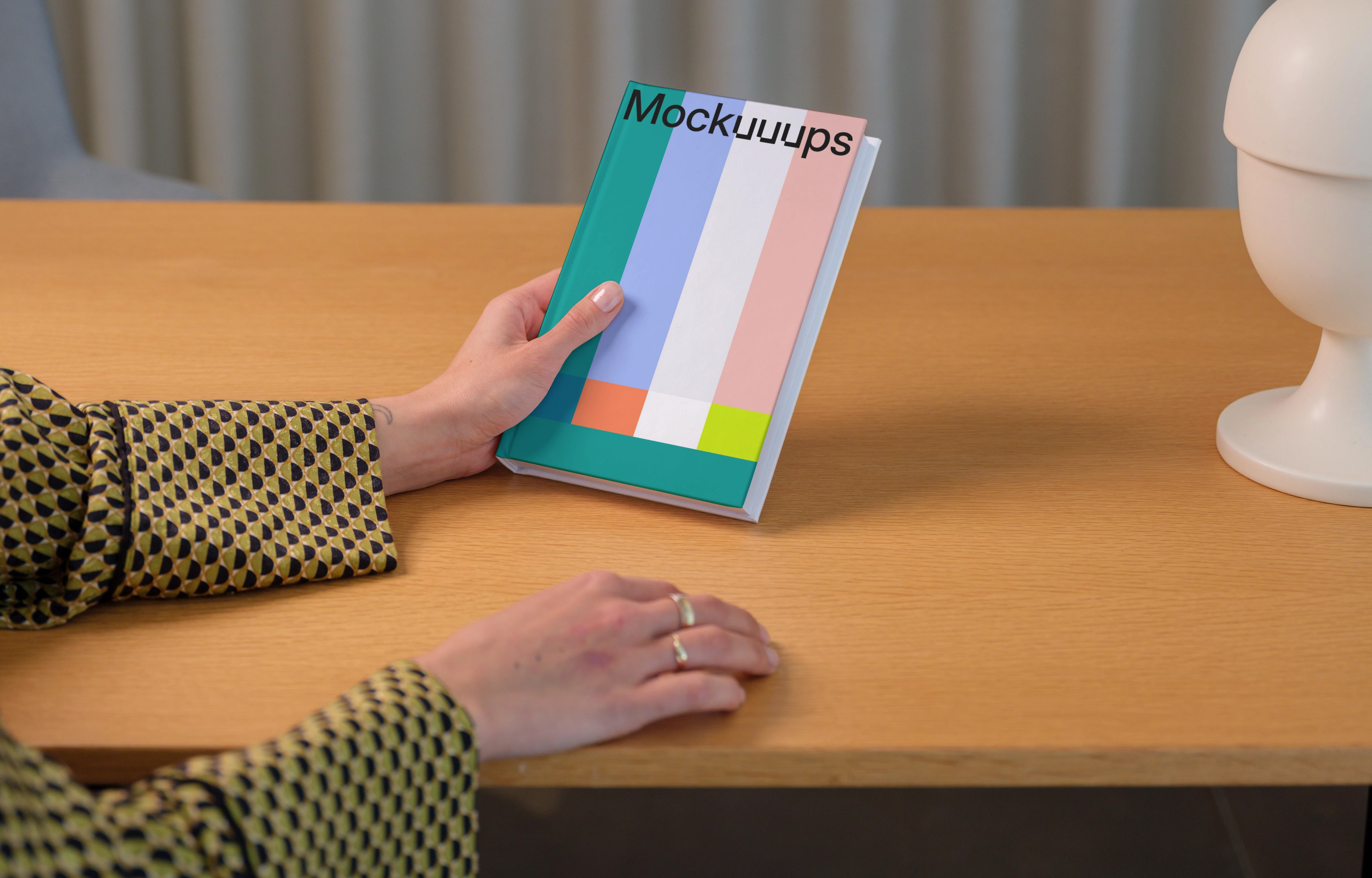 C-format book mockup on a wooden desk