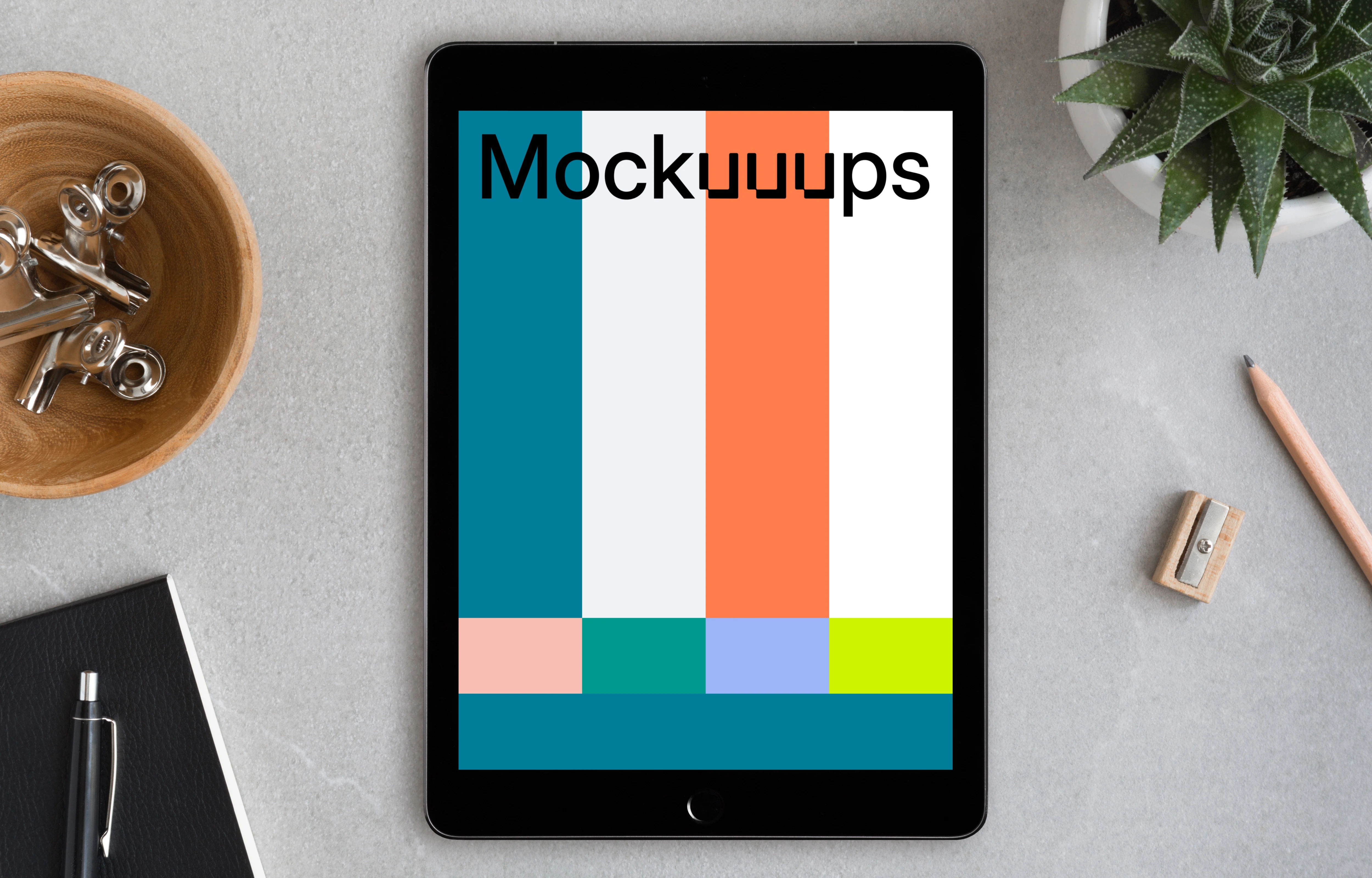 Center view of iPad Pro mockup on working desk