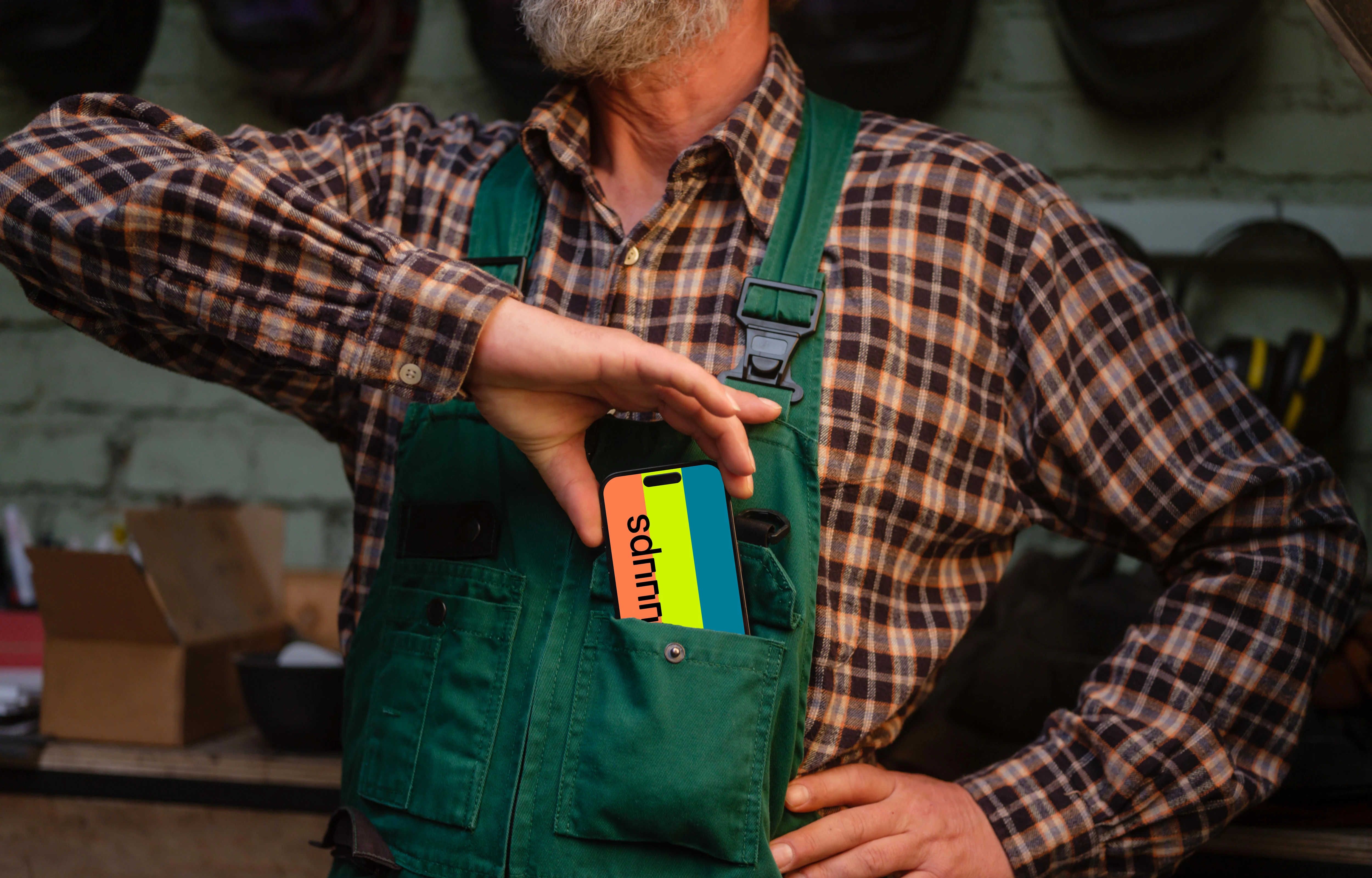 Crafter pulling out iPhone 14 Pro of his pocket