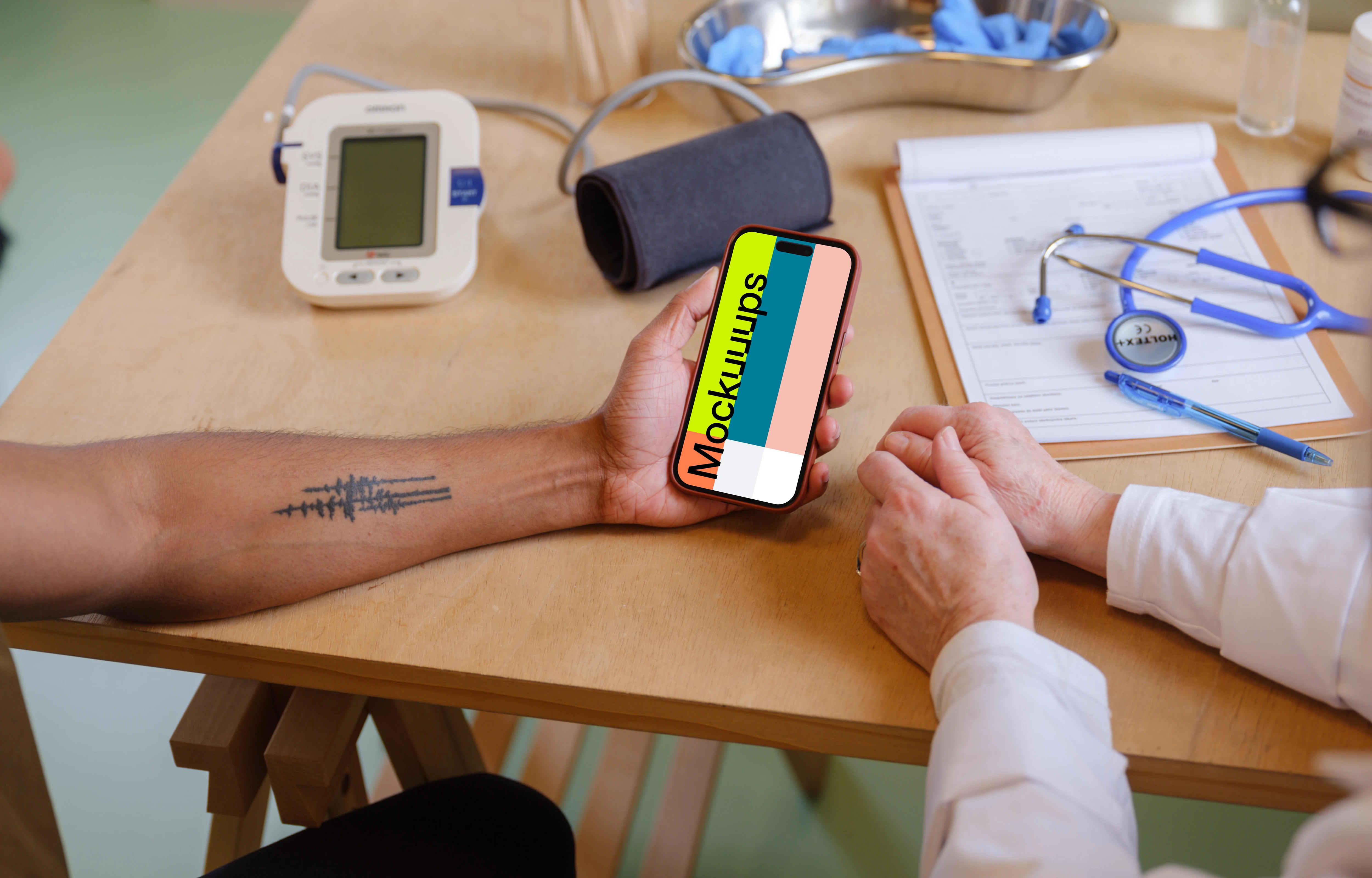 The patient holding a iPhone mockup in doctor’s office