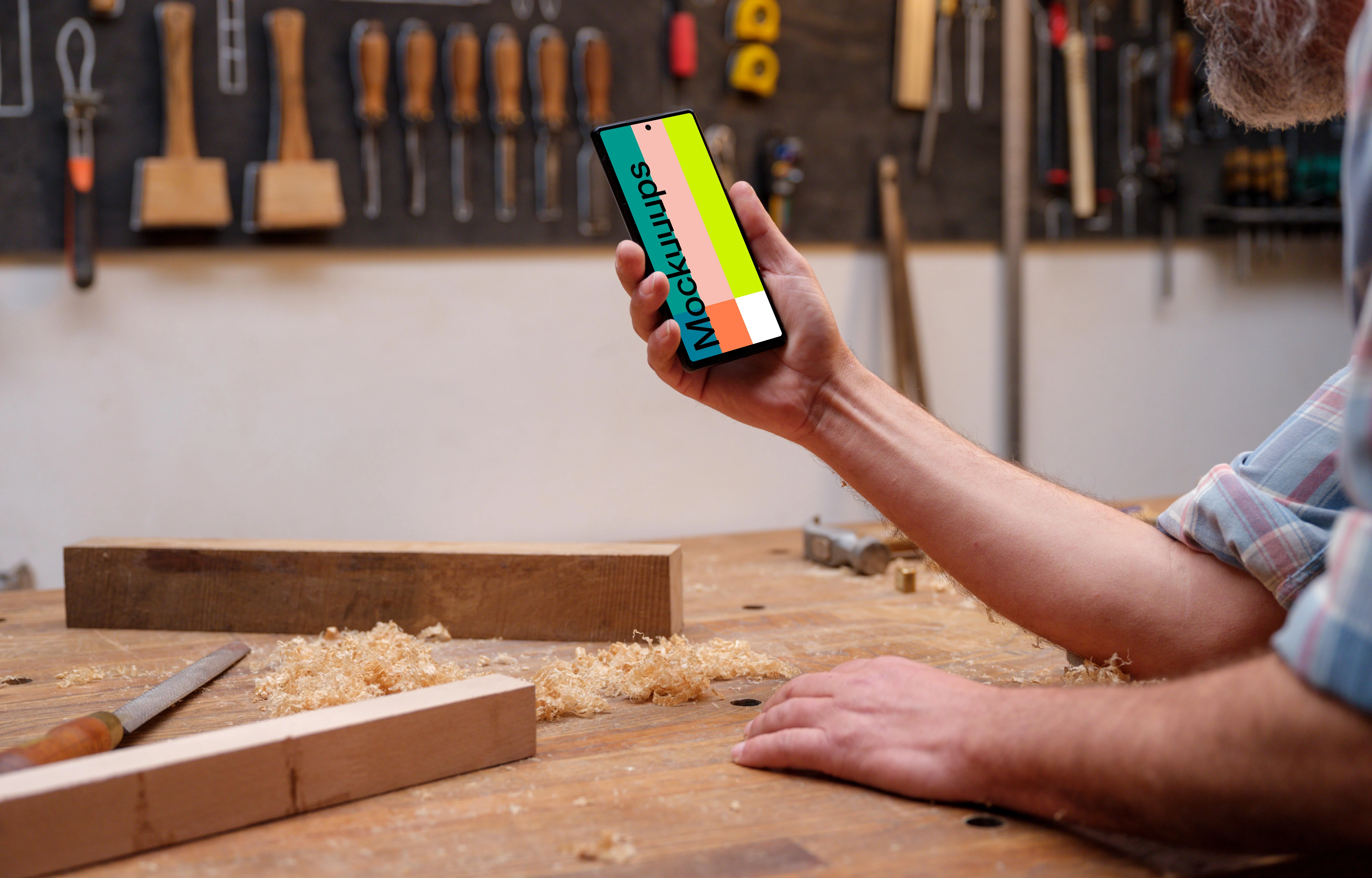 Google Pixel 6 mockup in carpenter's hand