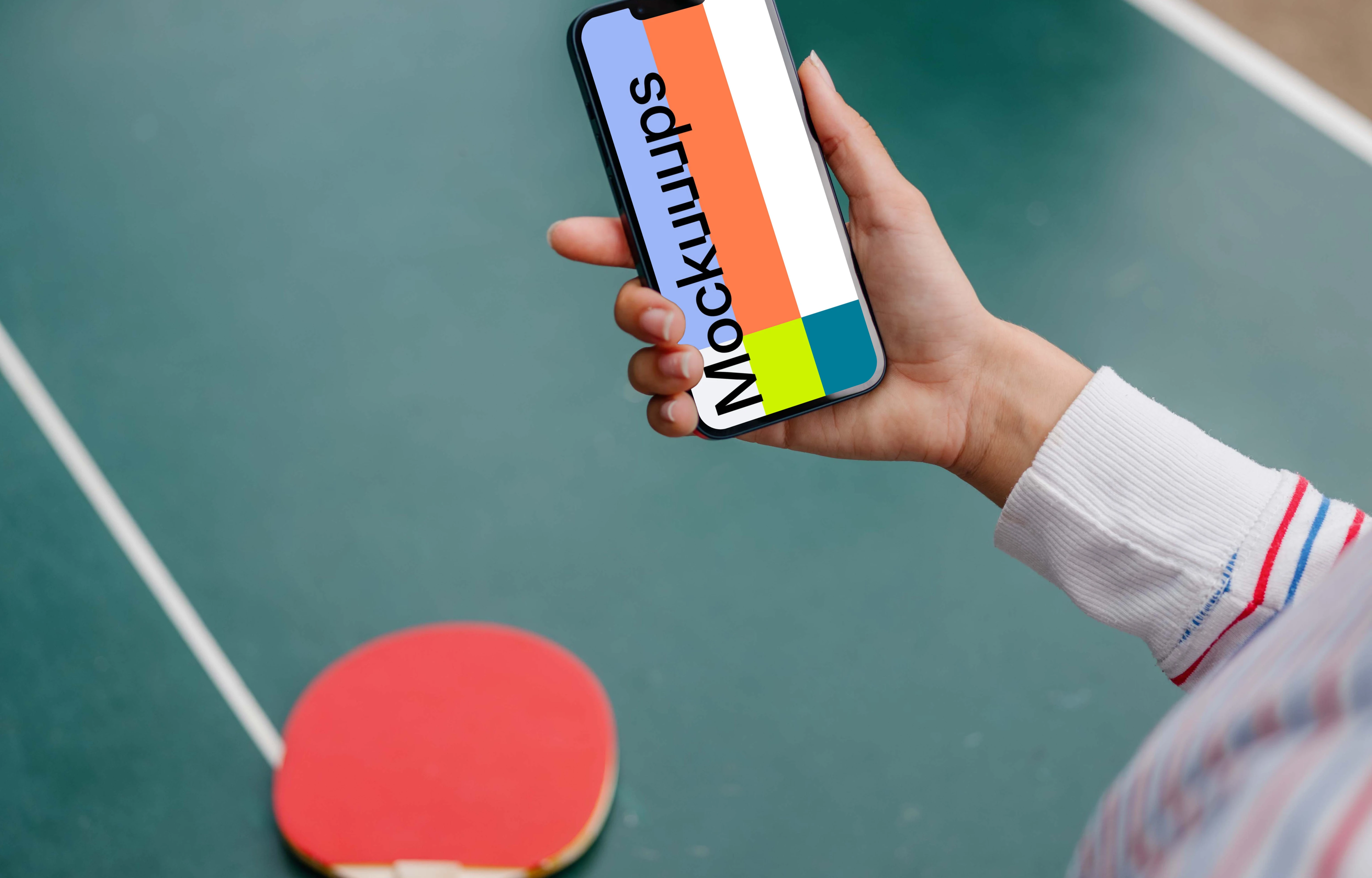 Hand holding an iPhone 13 mockup