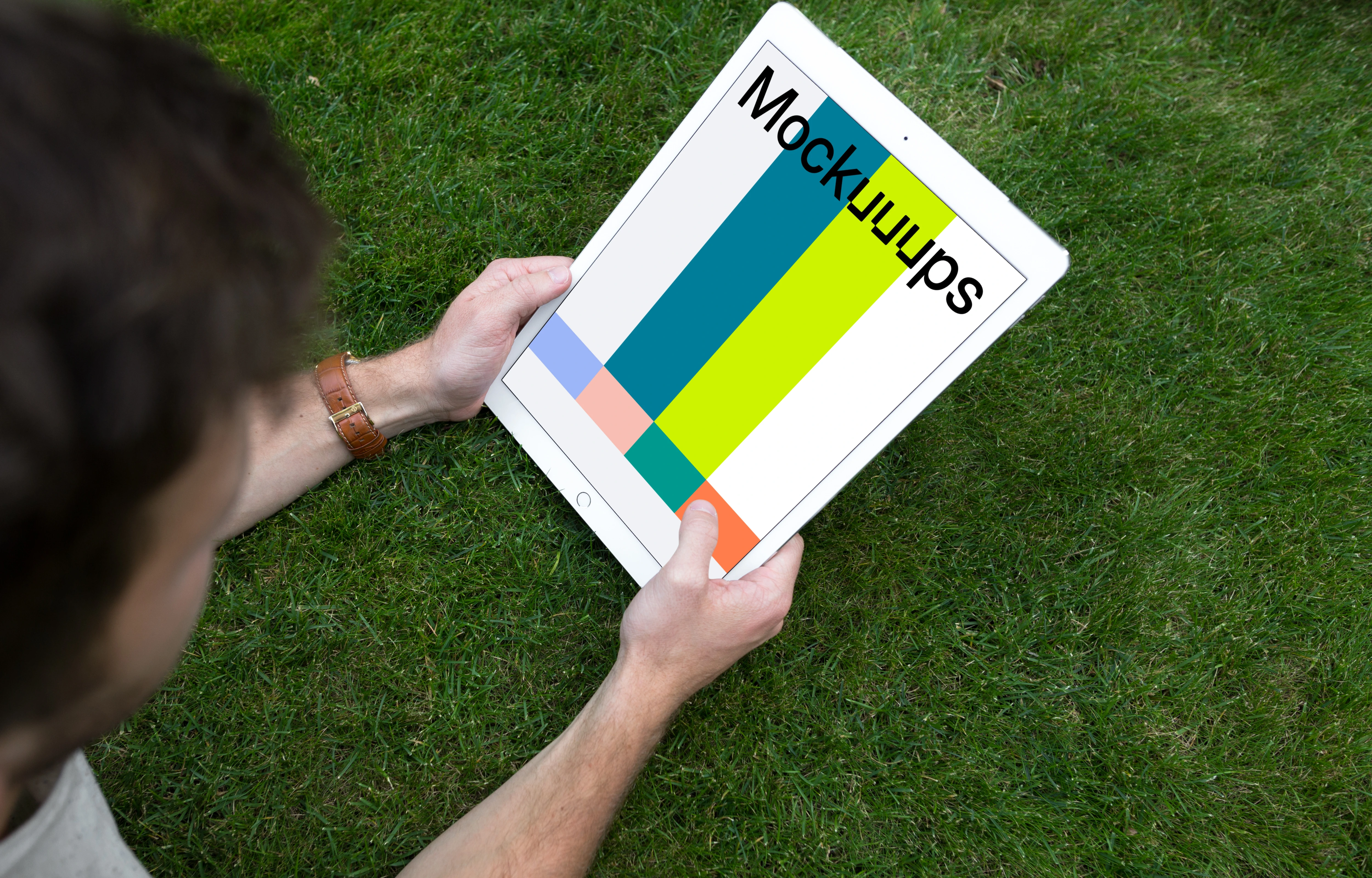 Holding iPad Pro mockup on the green background