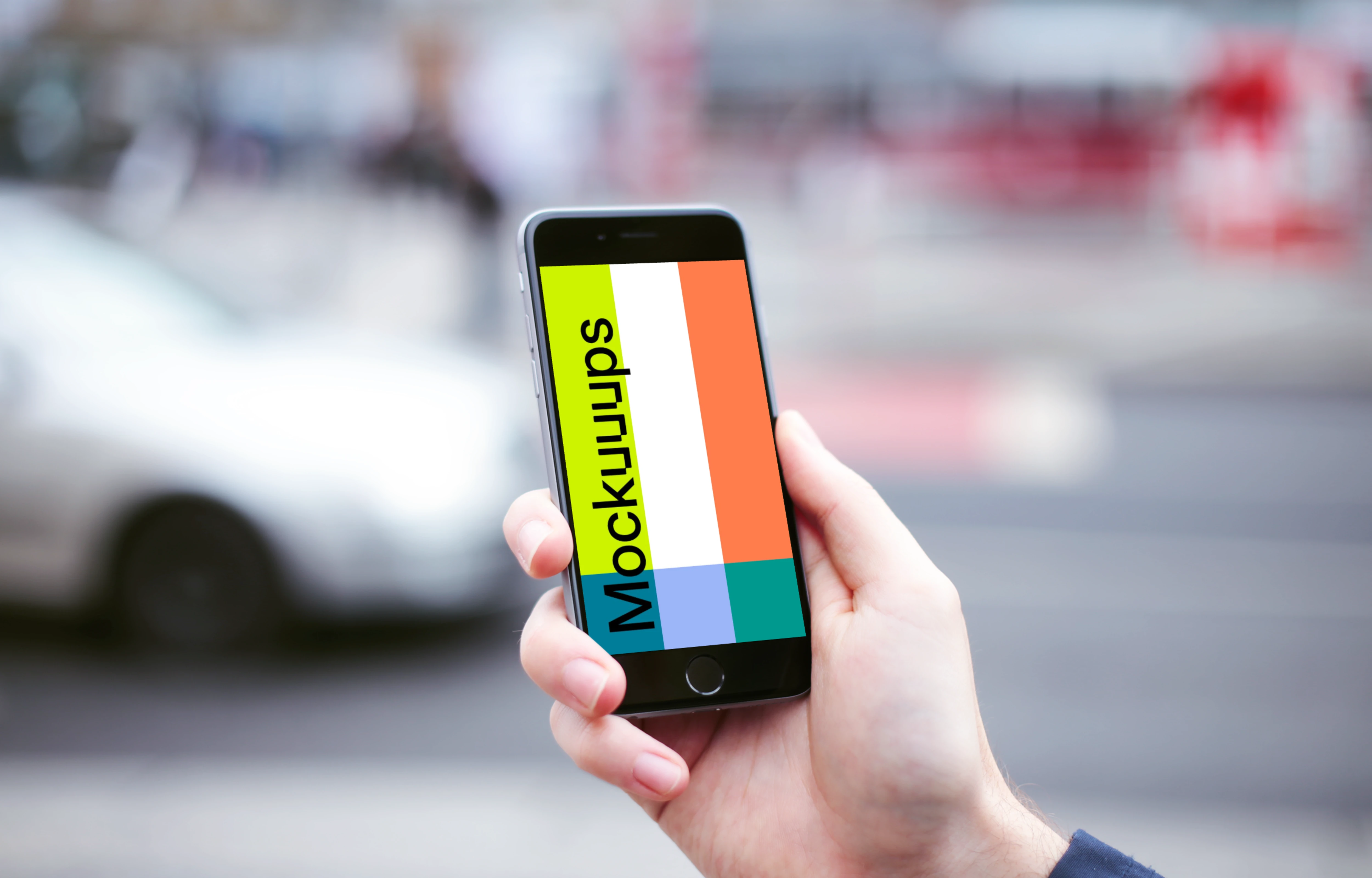 Holding iPhone 6 mockup and crossing the street