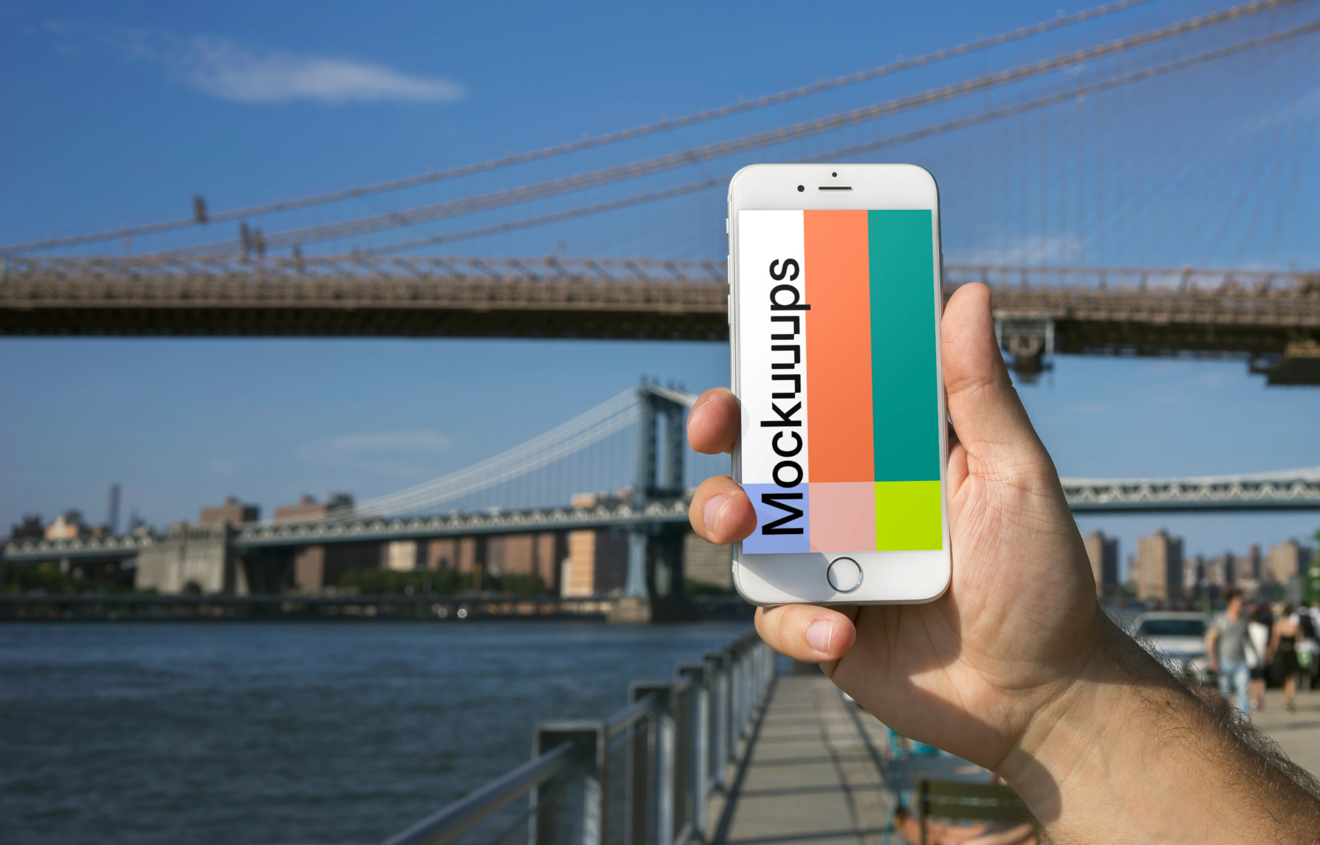 Holding iPhone 6 mockup in front of Brooklyn Bridge