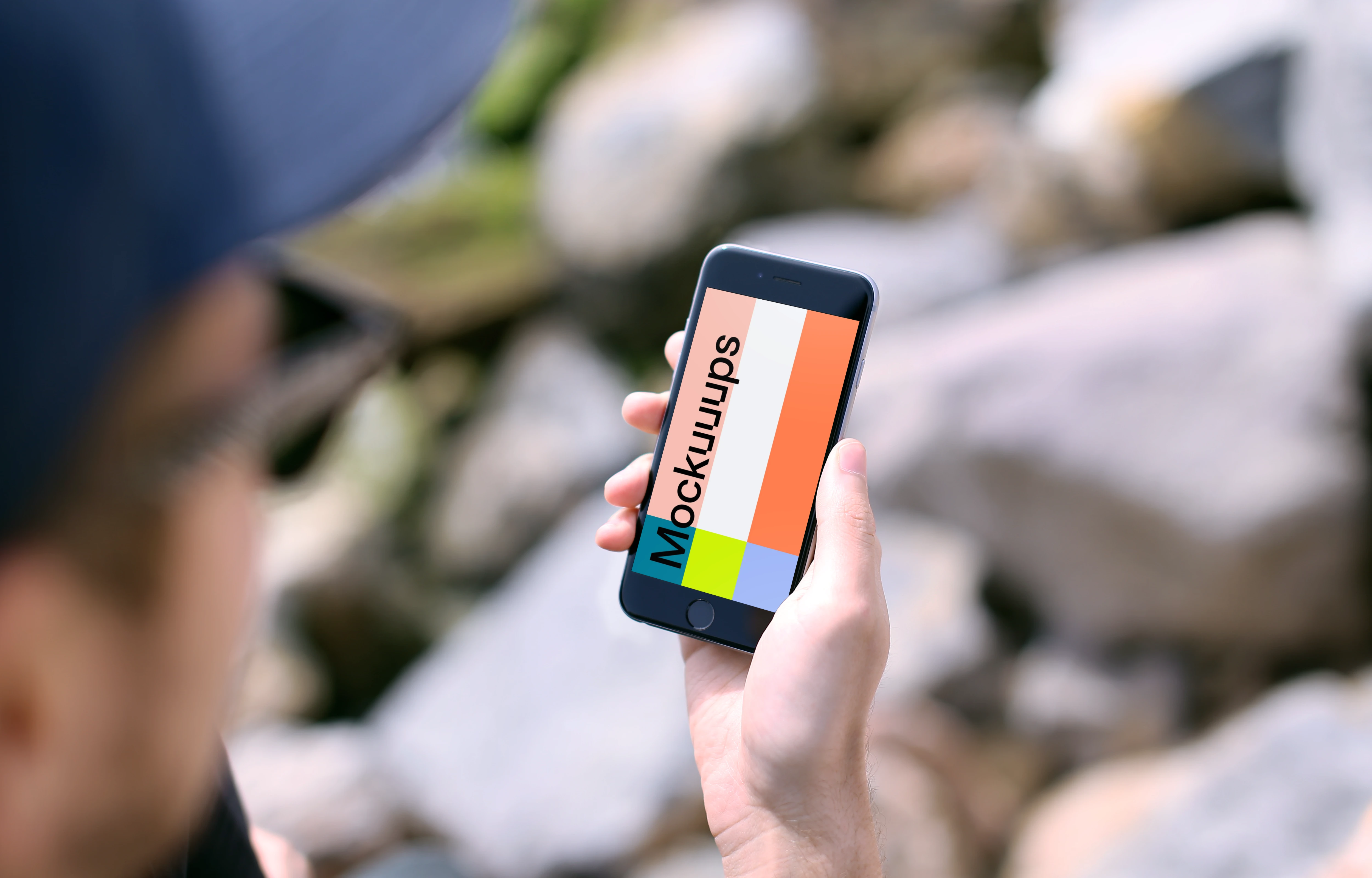 Holding iPhone 6s mockup during sunny day