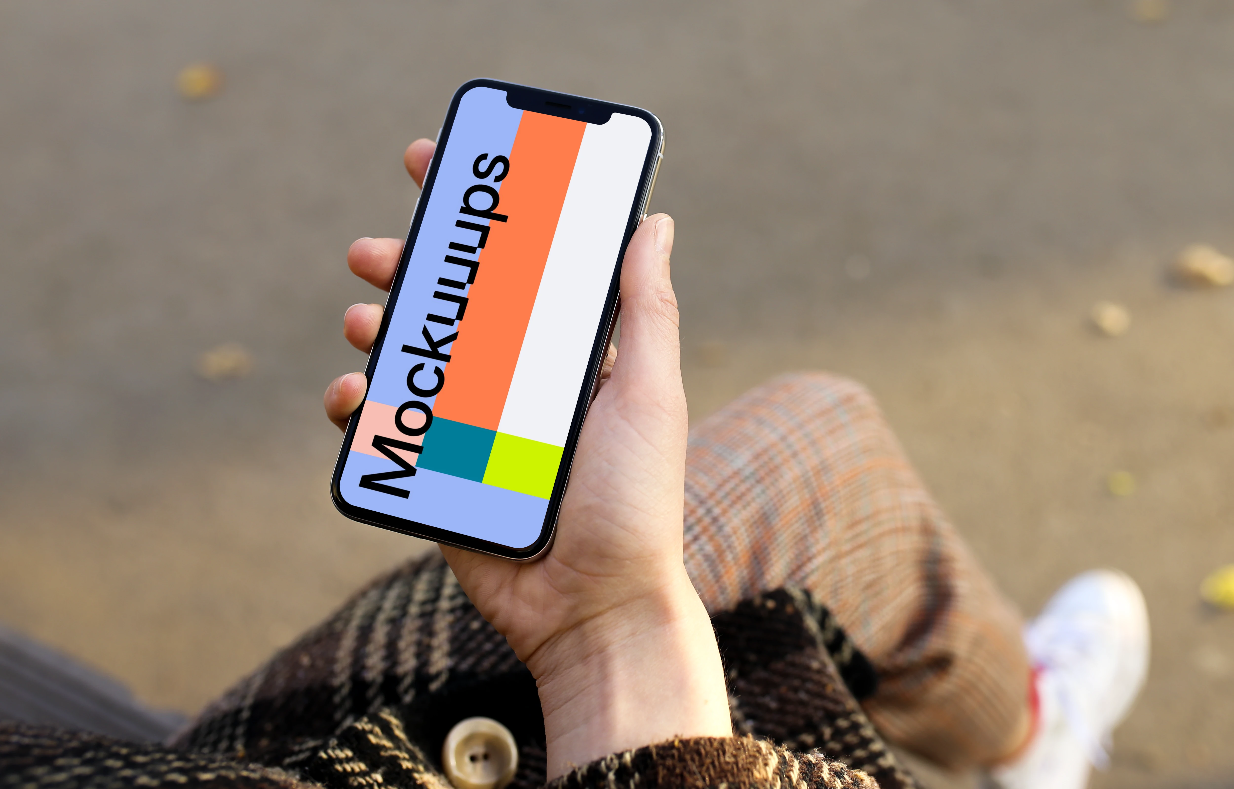 Holding iPhone X mockup