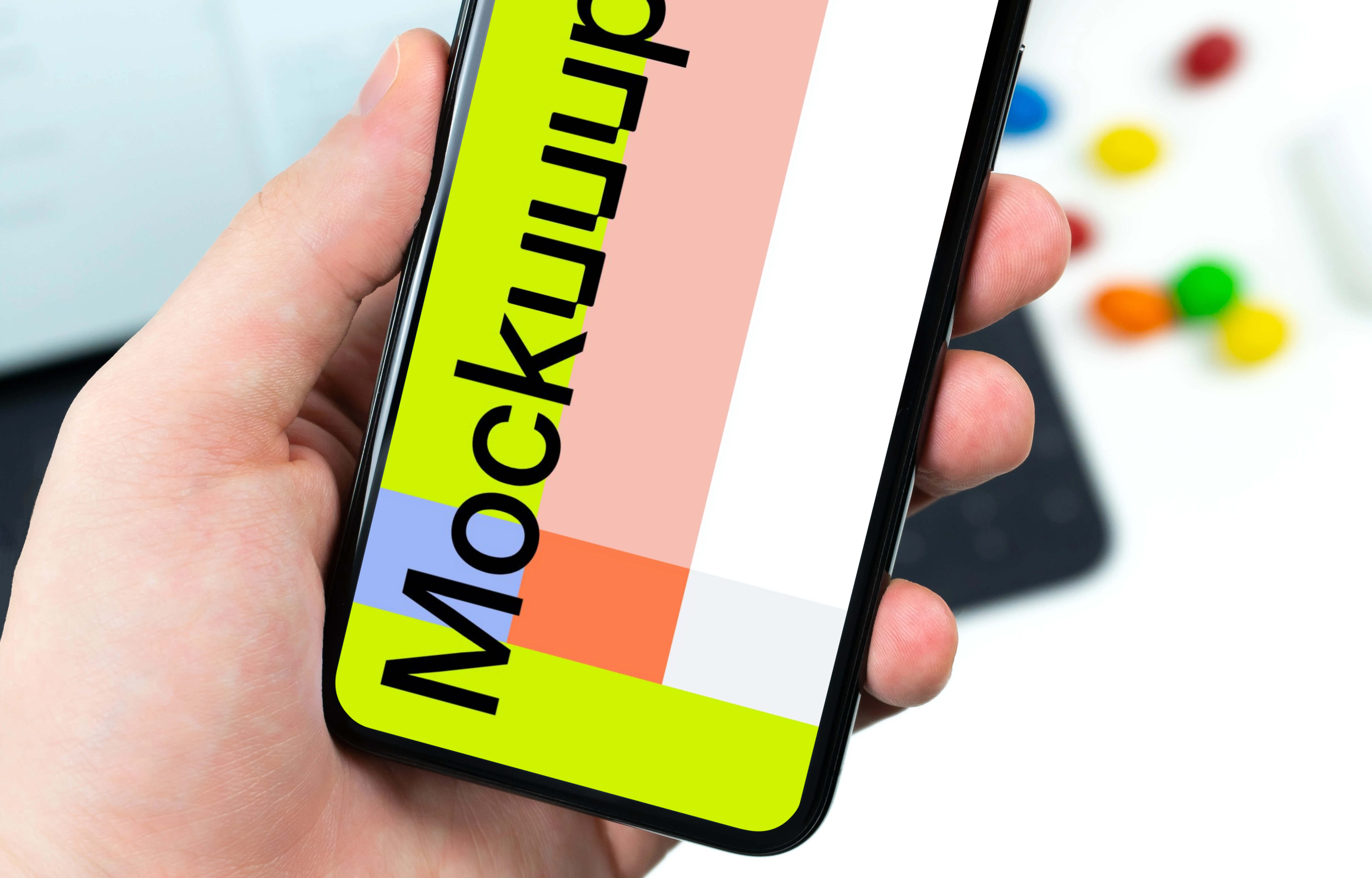 Holding iPhone XS mockup