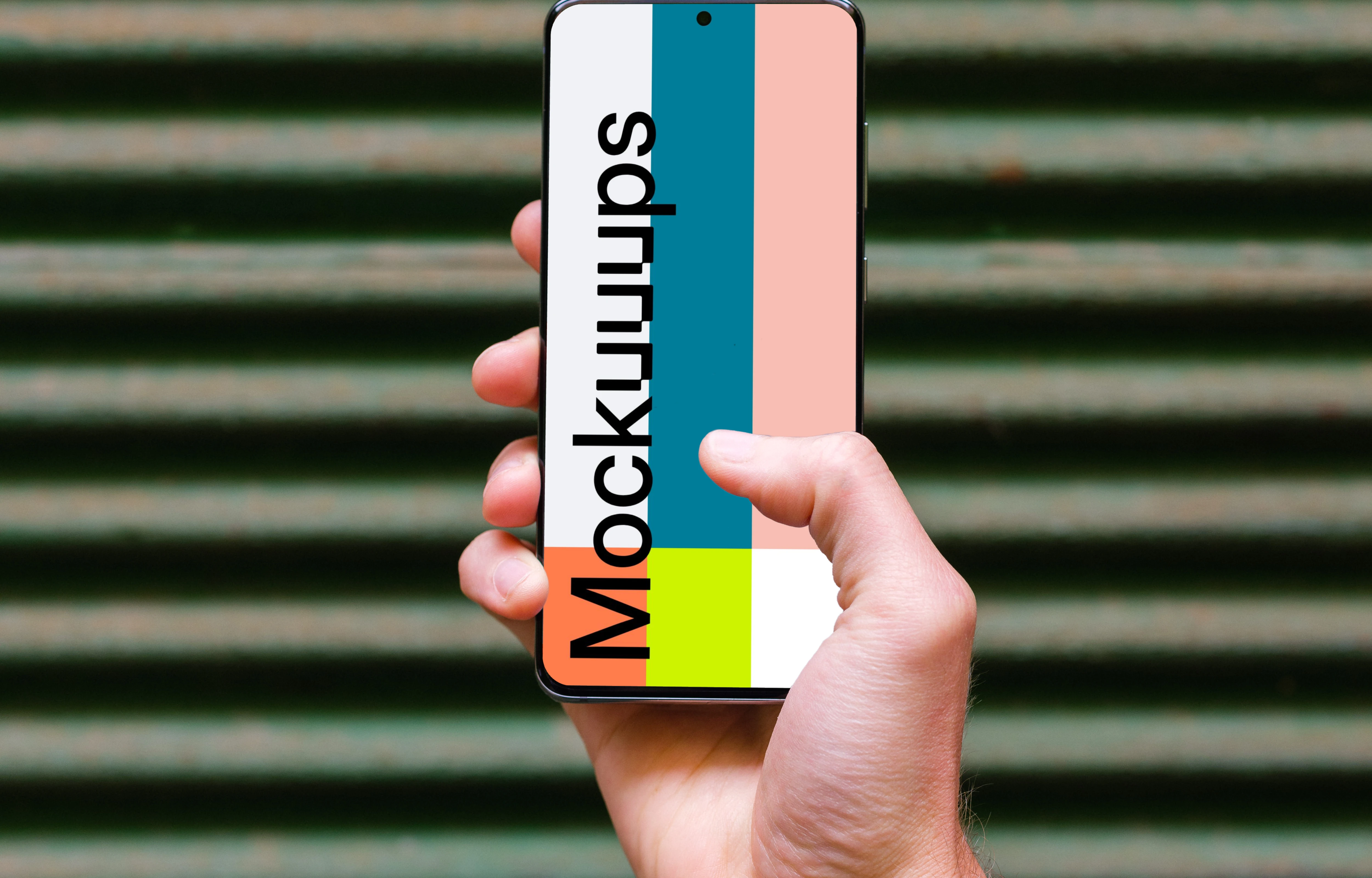 Holding Samsung Galaxy S20 mockup against metal fence