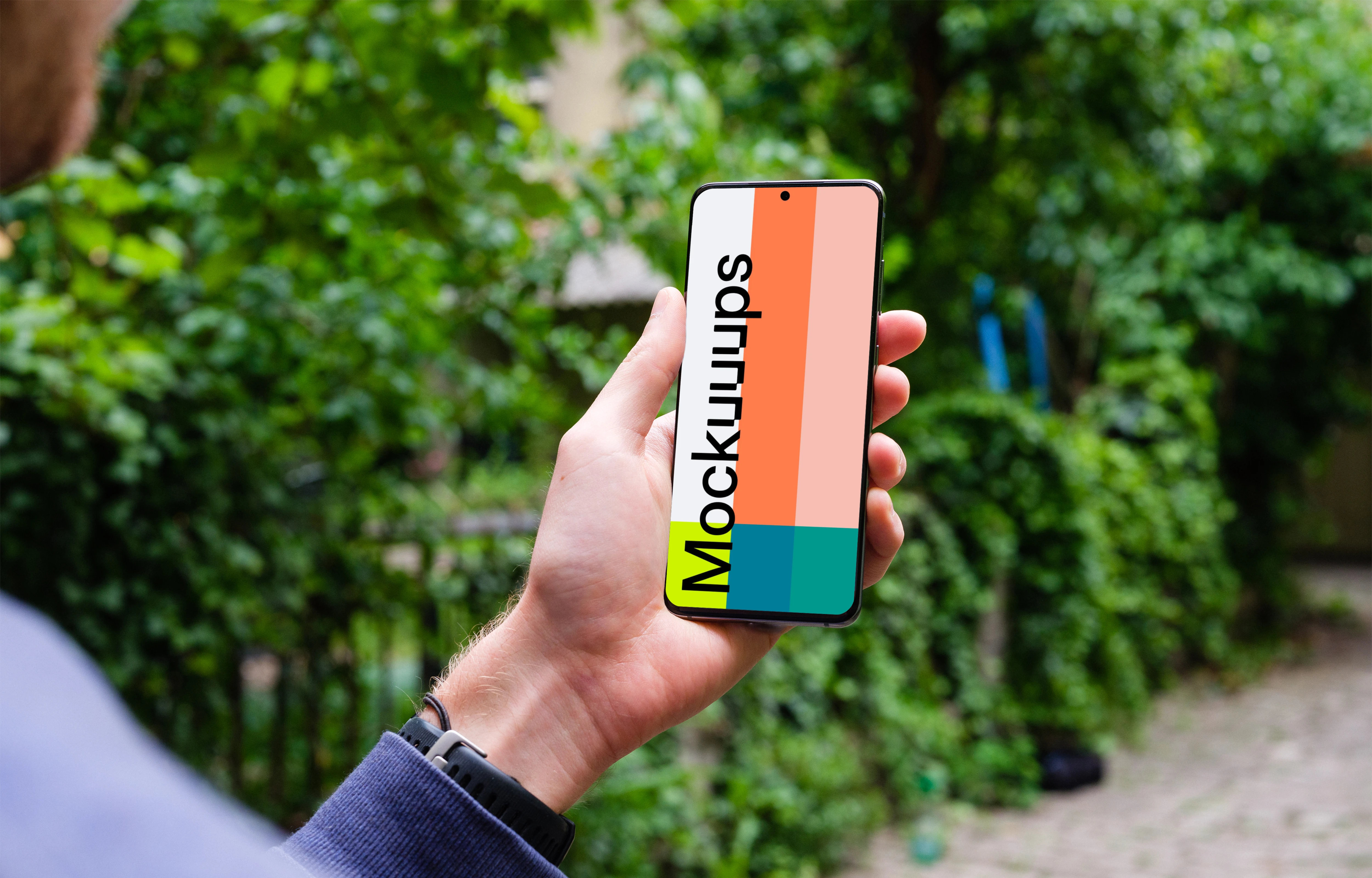 Holding Samsung Galaxy S20 mockup amongst trees